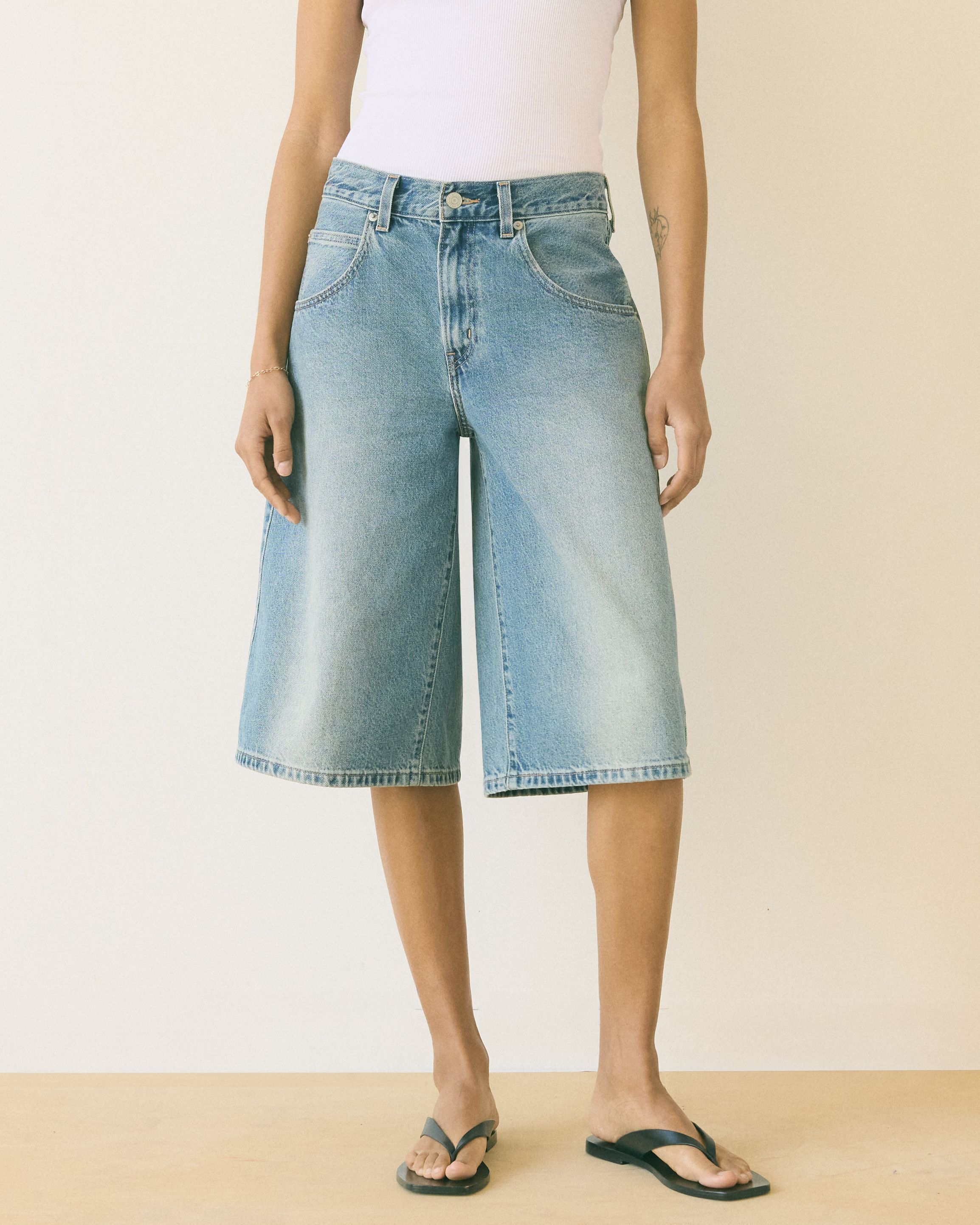 Model wearing loose fit shorts