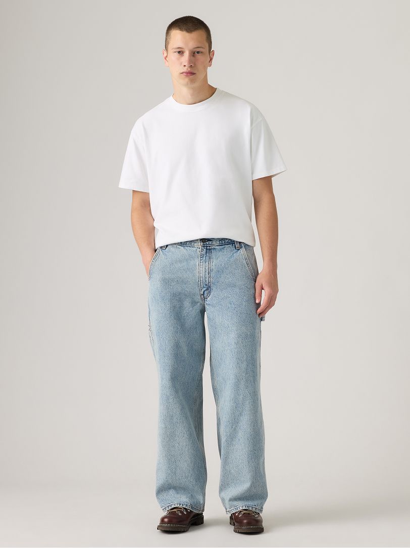 Image of model wearing baggy jeans