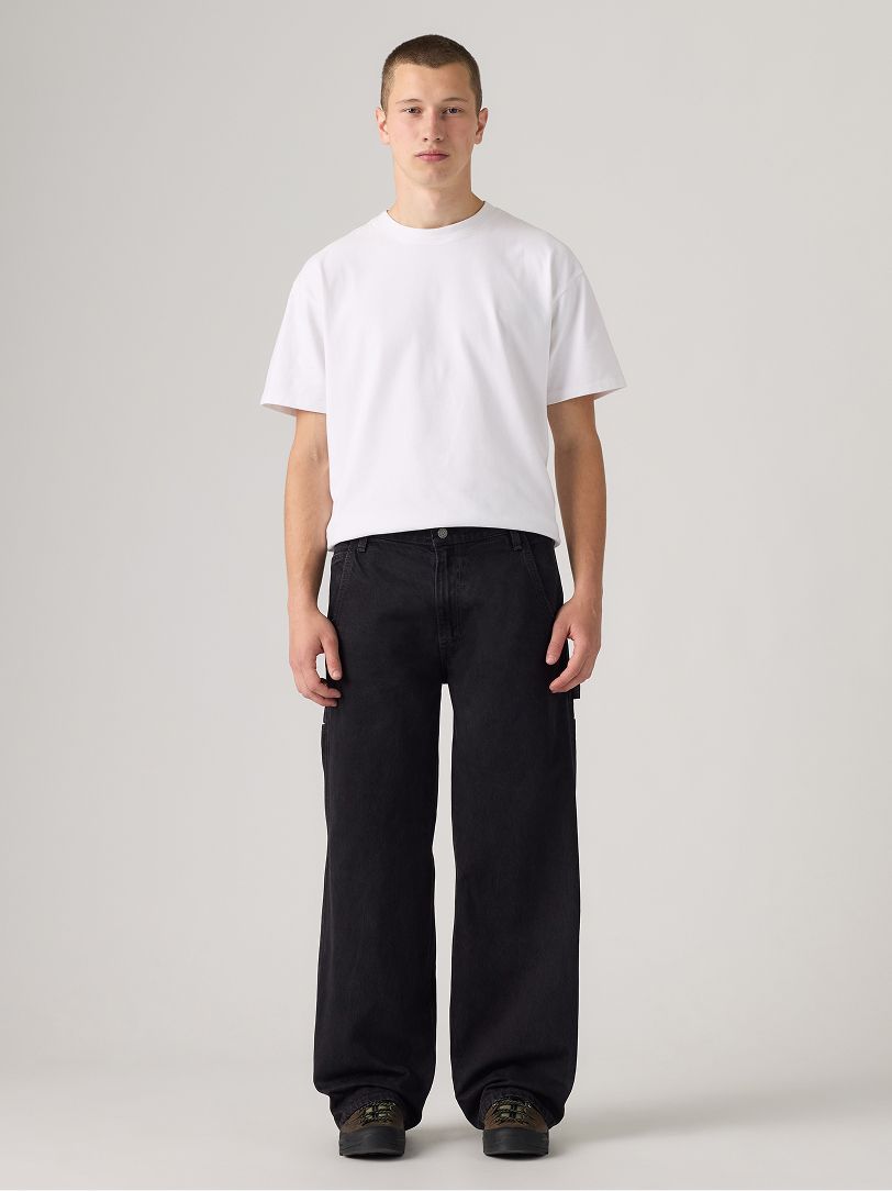 Image of model wearing baggy jeans