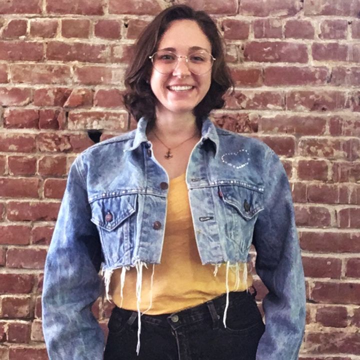 crystal denim jacket on woman smiling