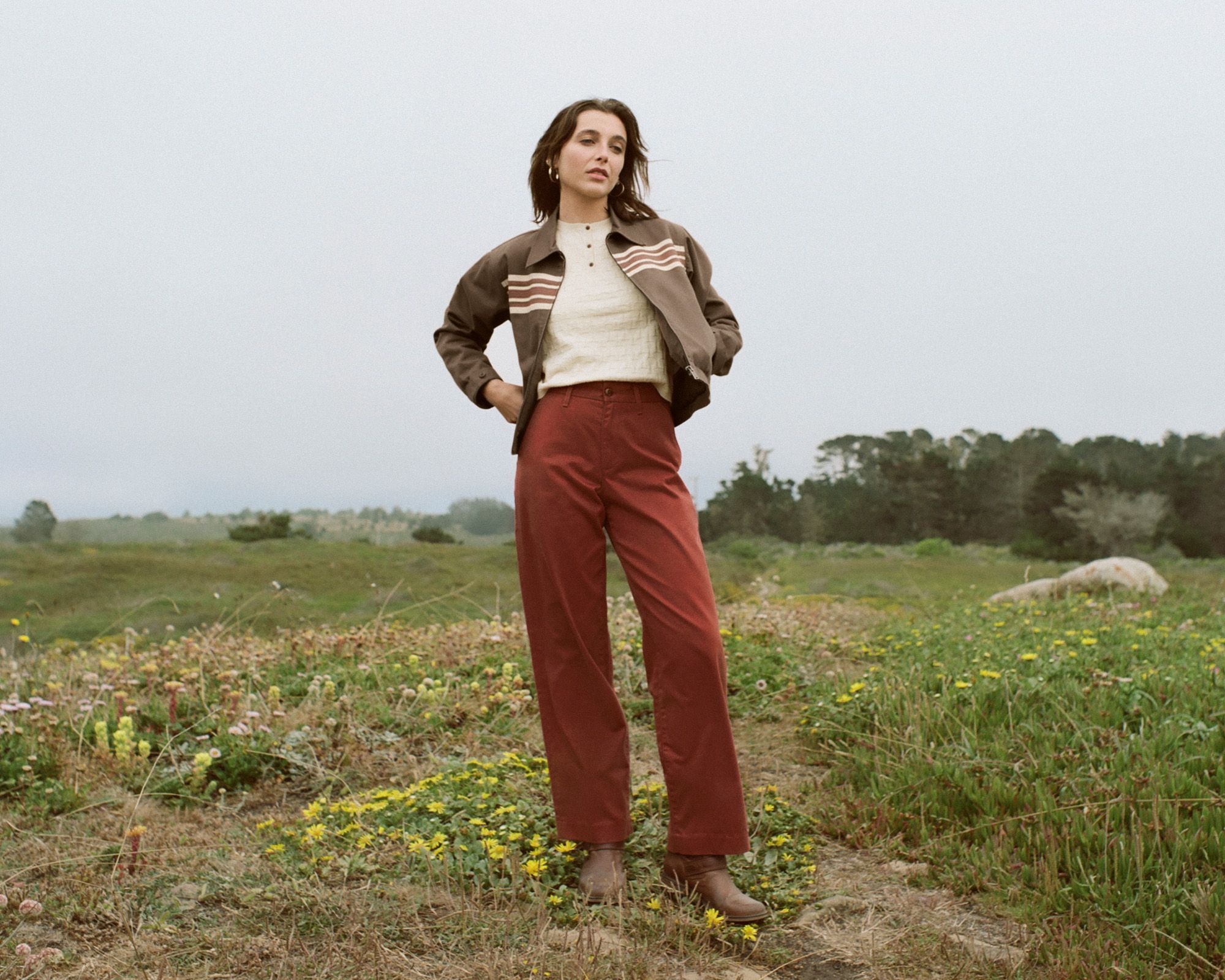 Image of Emma Chamberlain wearing the Levi's® x Emma Chamberlain collaboration against a rocky backdrop