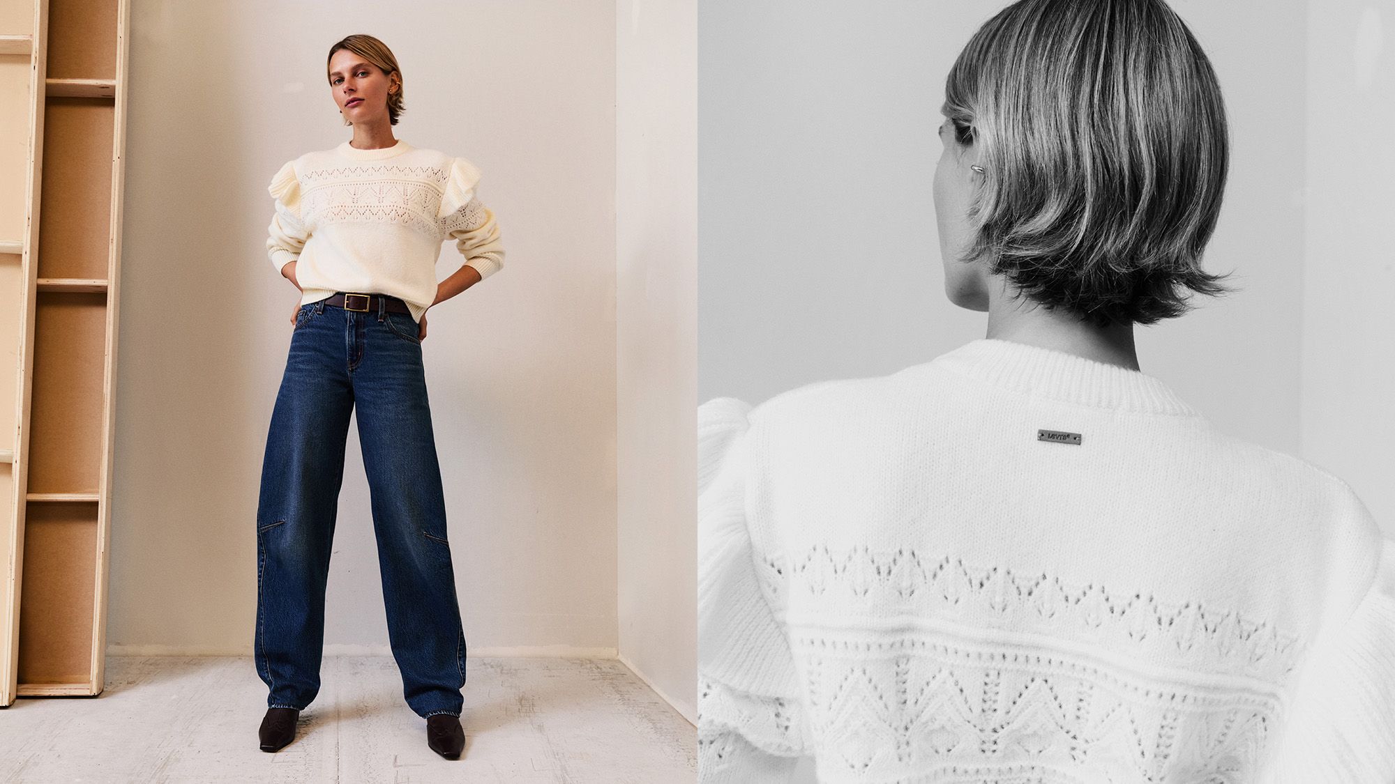 Model with short hair wearing dark wash denim and white pointelle sweater