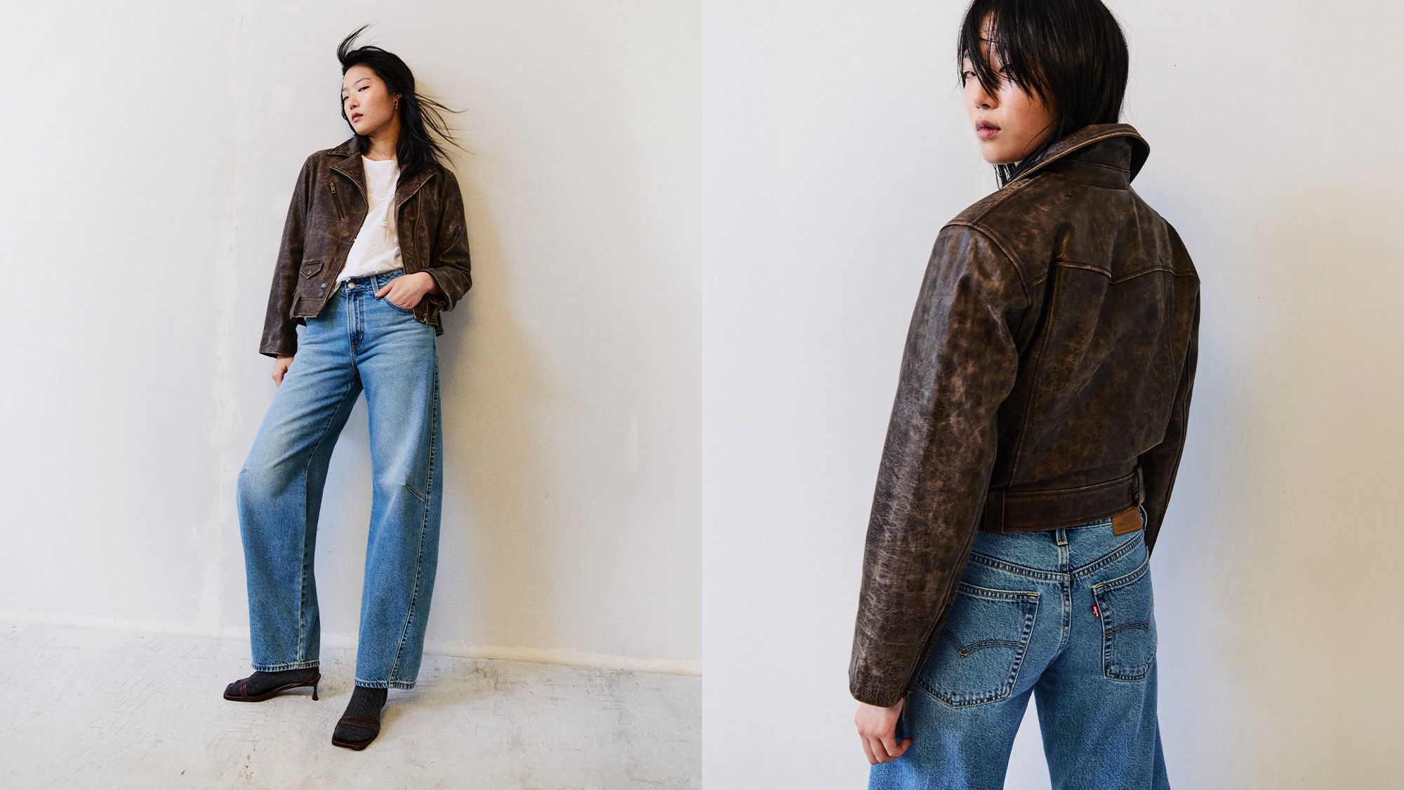 Model in light wash denim and brown leather jacket