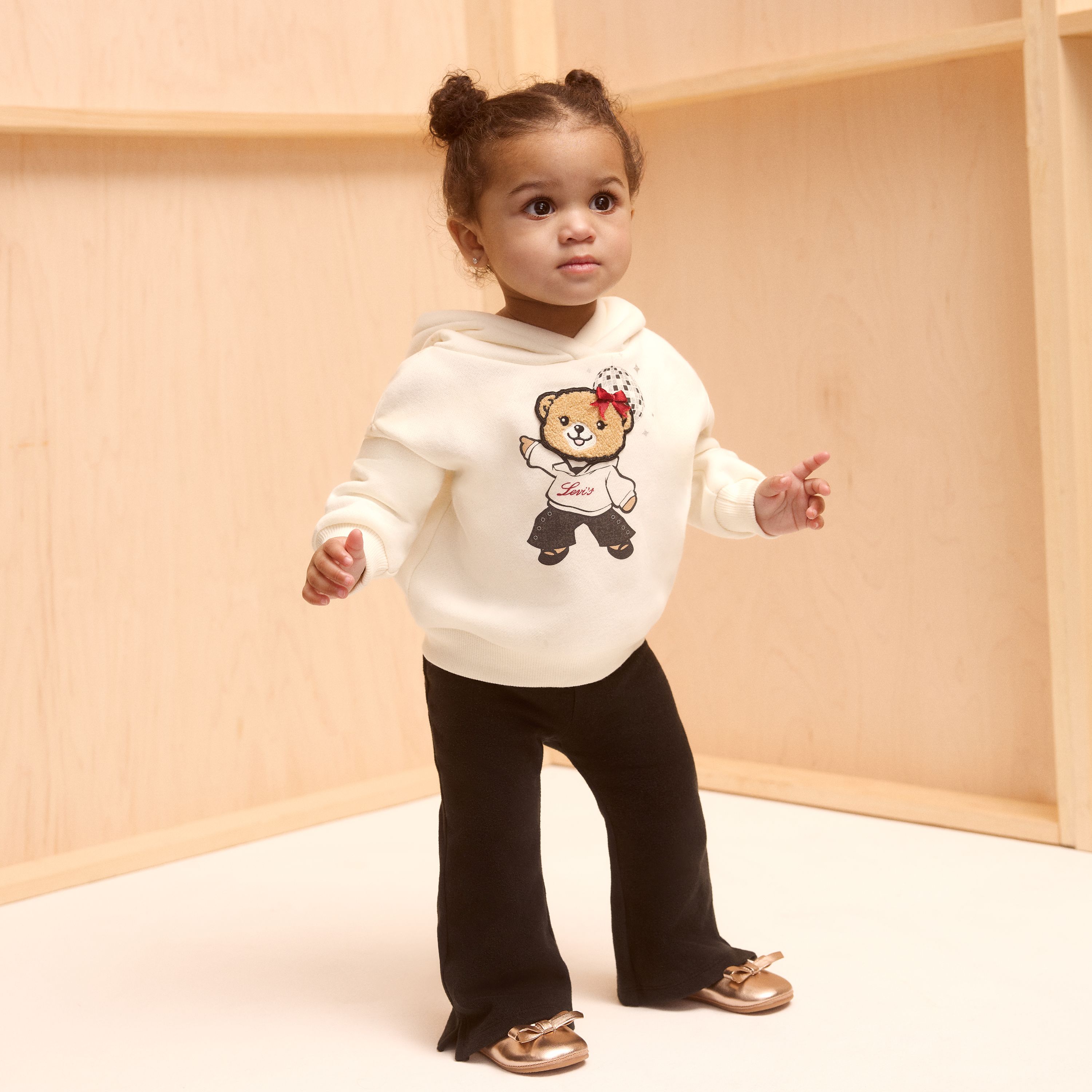 Toddler model wearing shorts and a tee.