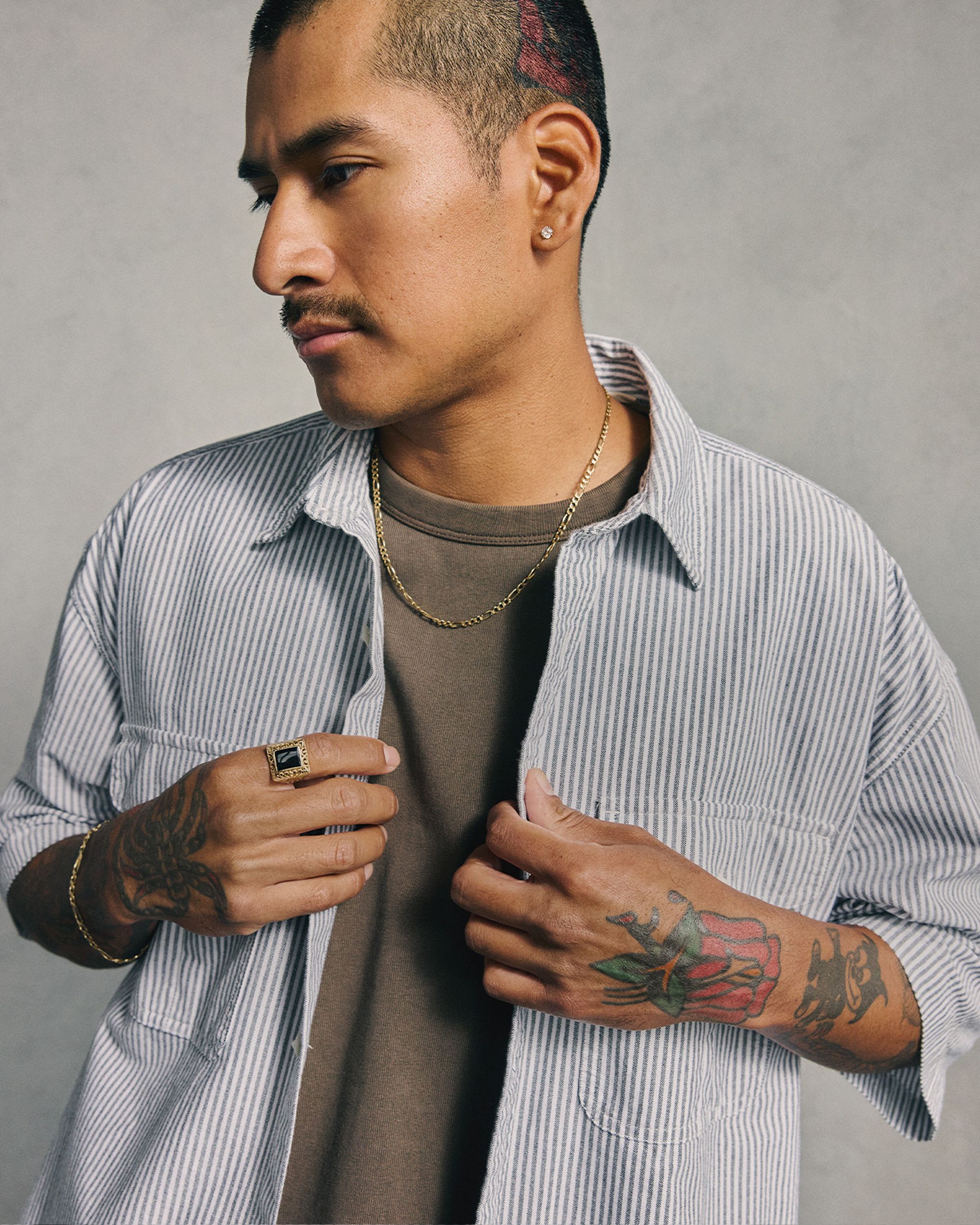 Closeup of model in button down shirt