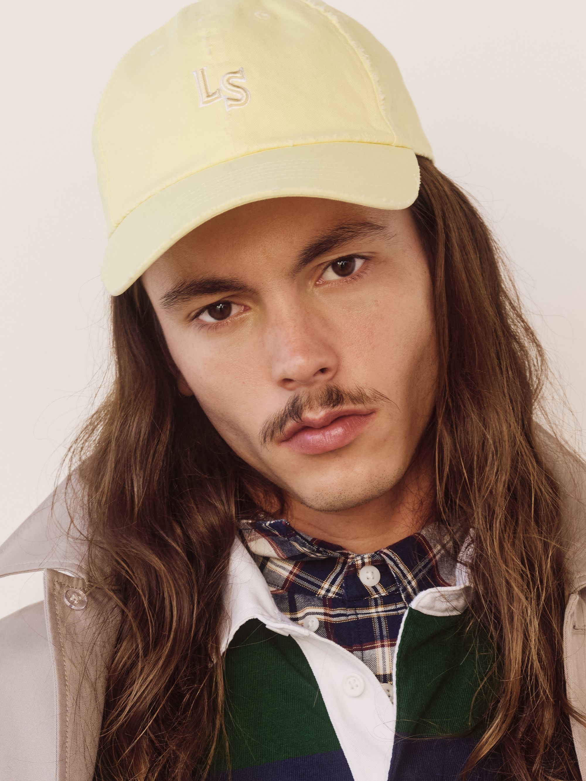 Model wearing monogram cap