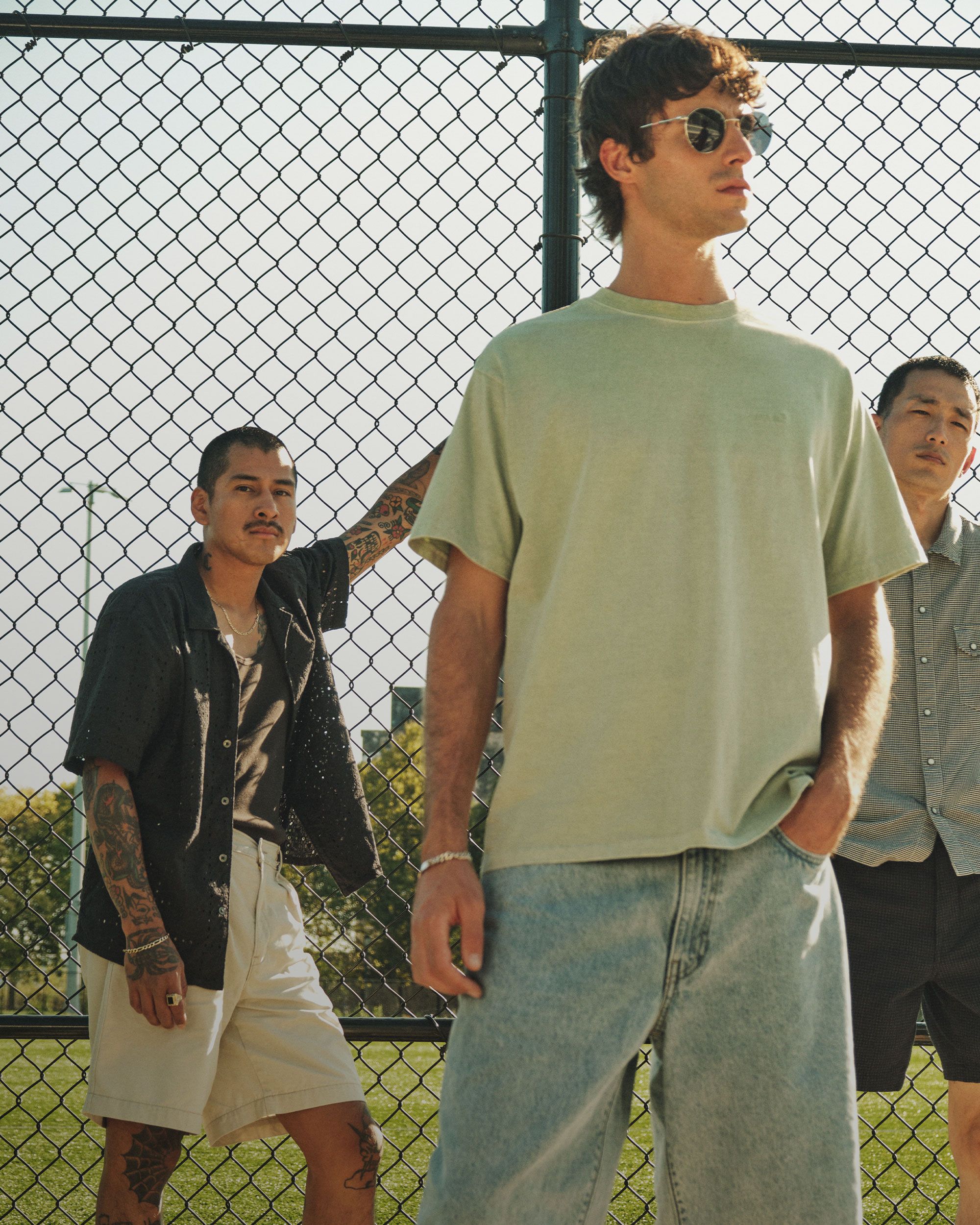 Group of models in men's new tops