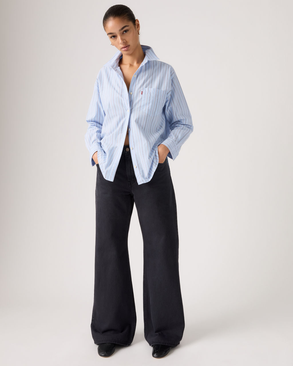 Model in new black wash women's Loose Boot jeans