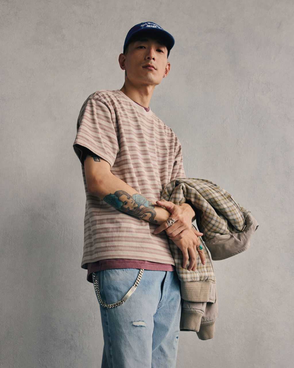 Model in layered men's garment dyed tees