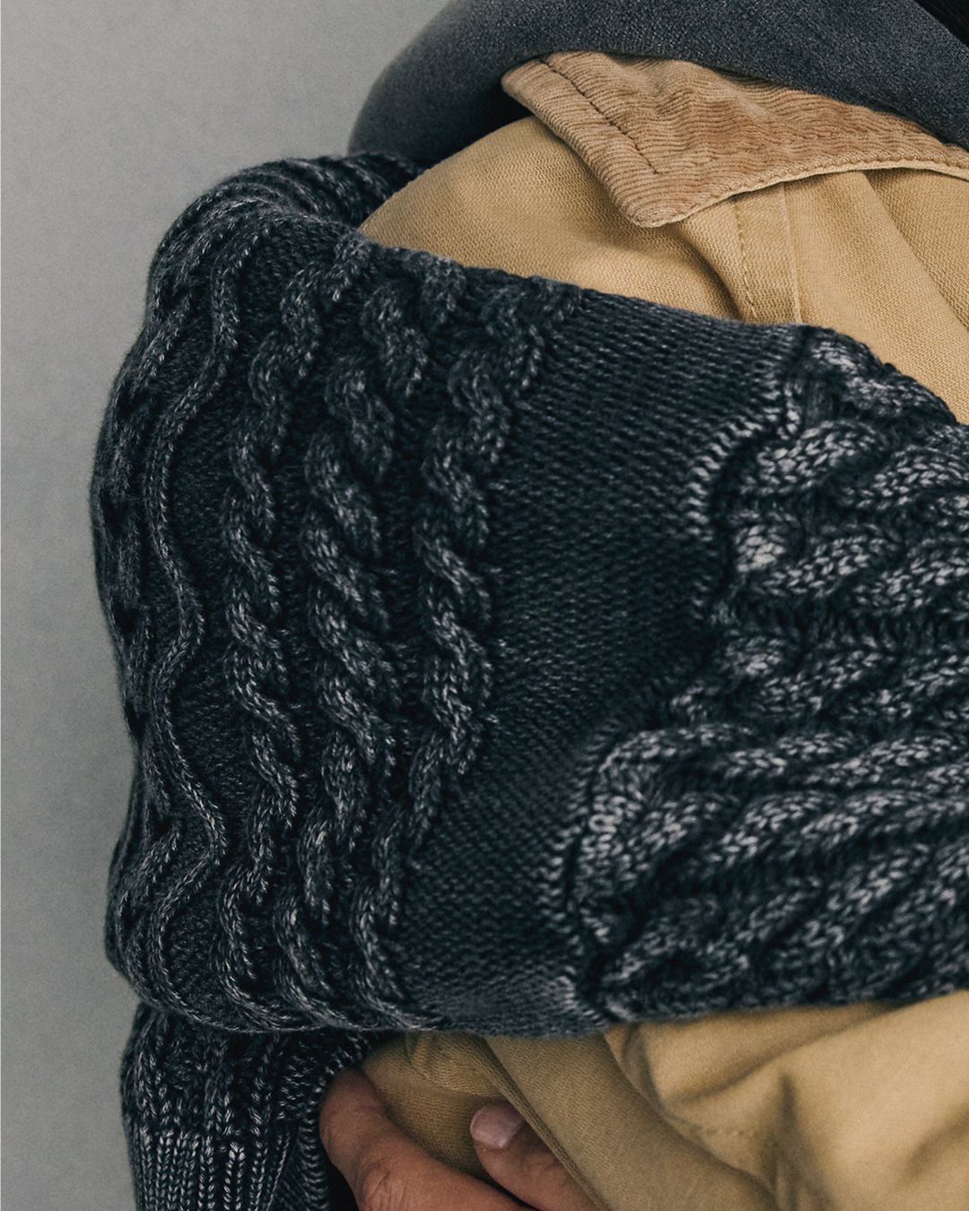 Close up texture shot of a grey-ish black garment dyed sweater