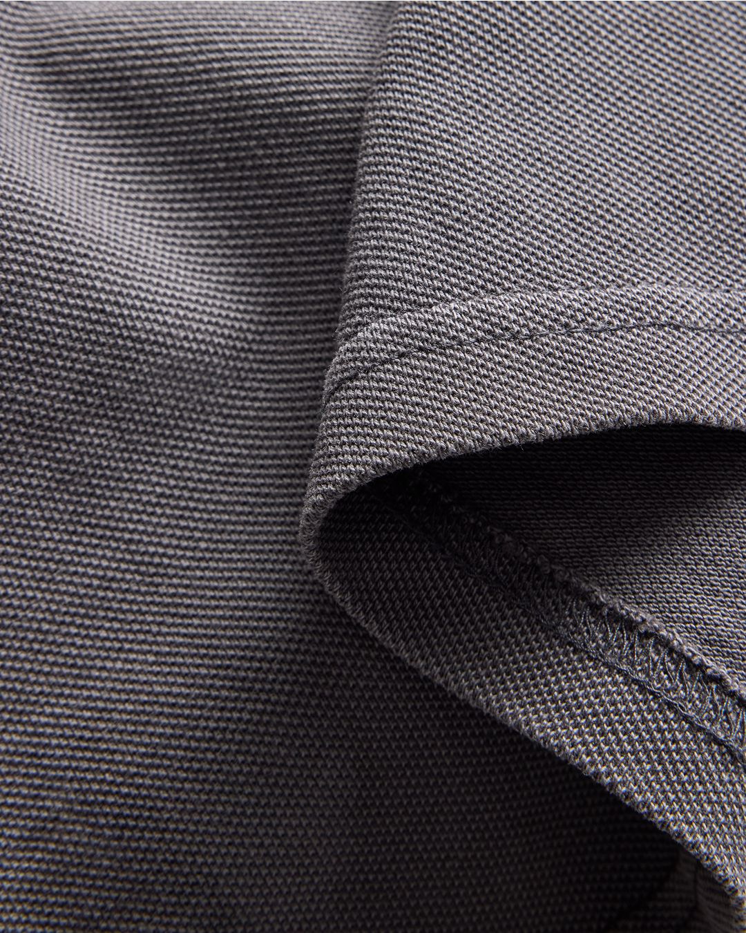 closeup of a grey polo garment dyed texture swatch