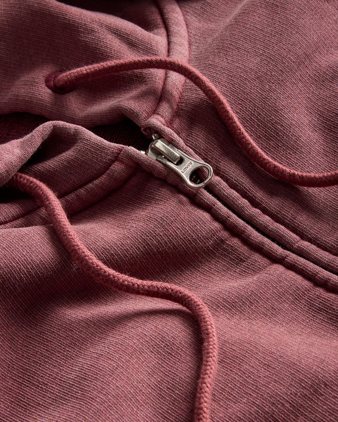 closeup of a burgundy hoodie garment dyed texture swatch