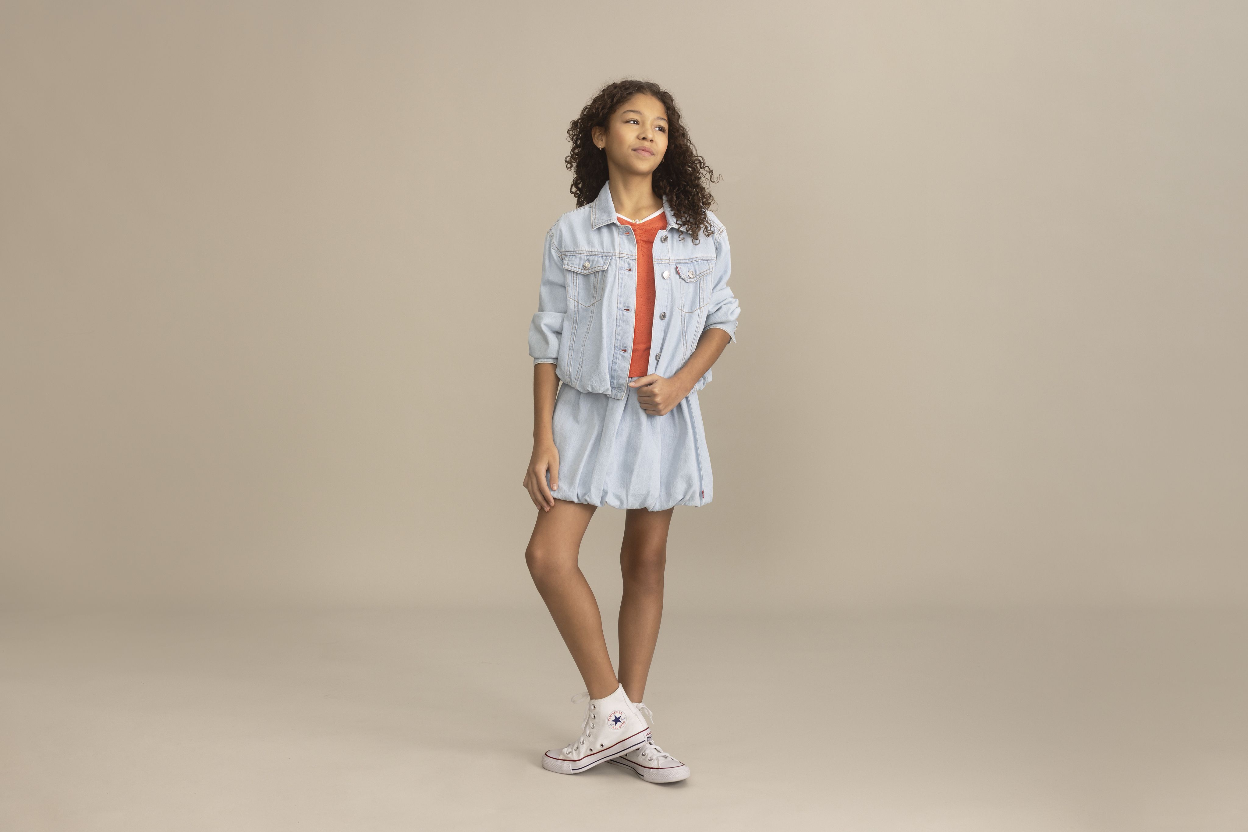 Big girl model wearing shorts and a tee.