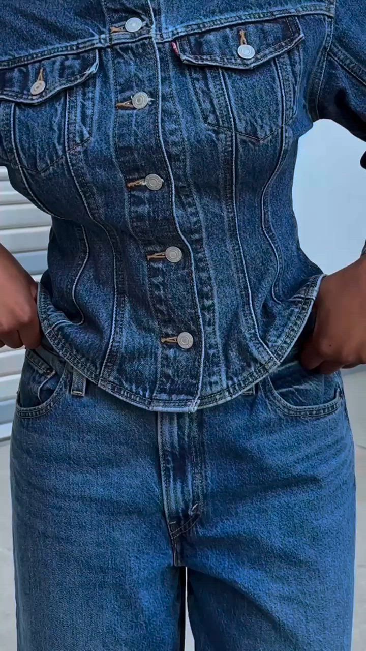 Video of model buttoning cinch on jeans