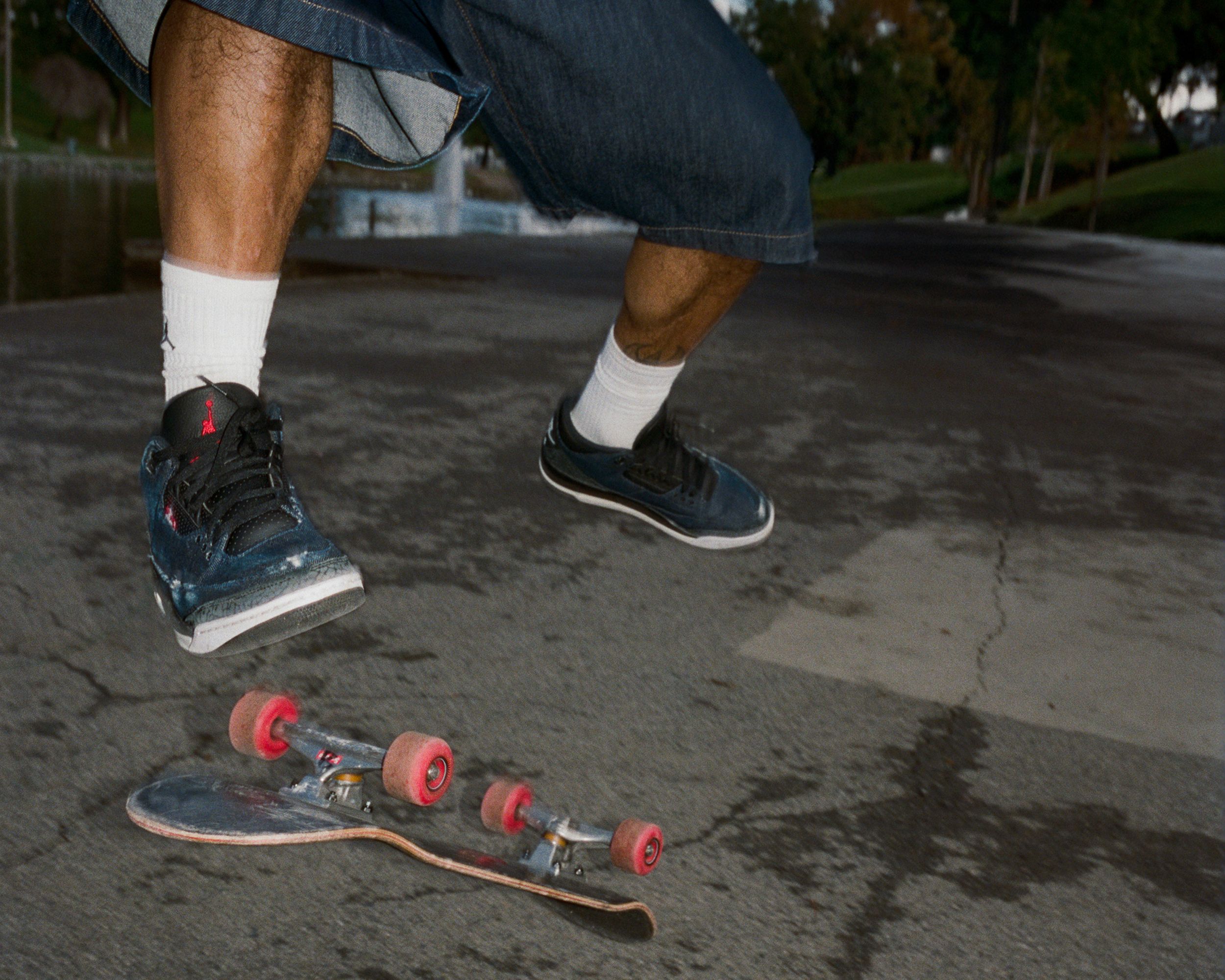 Model skateboarding in Levis® x Jordan sneakers 