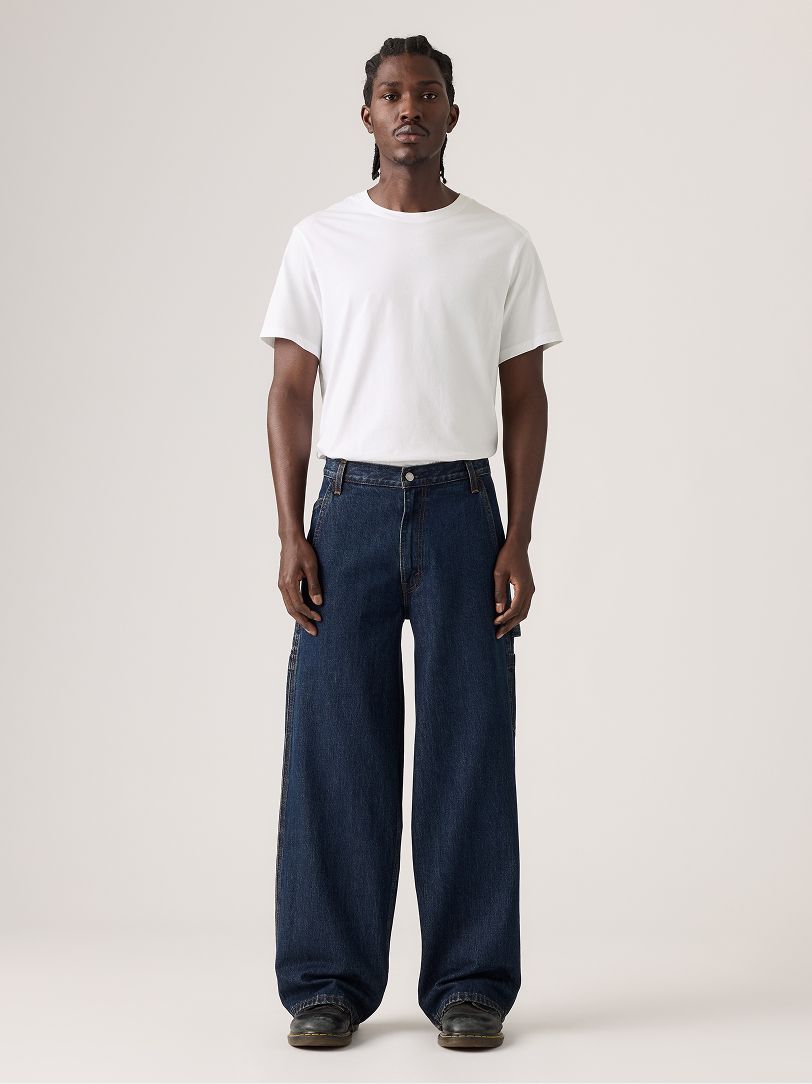 Image of model wearing baggy jeans