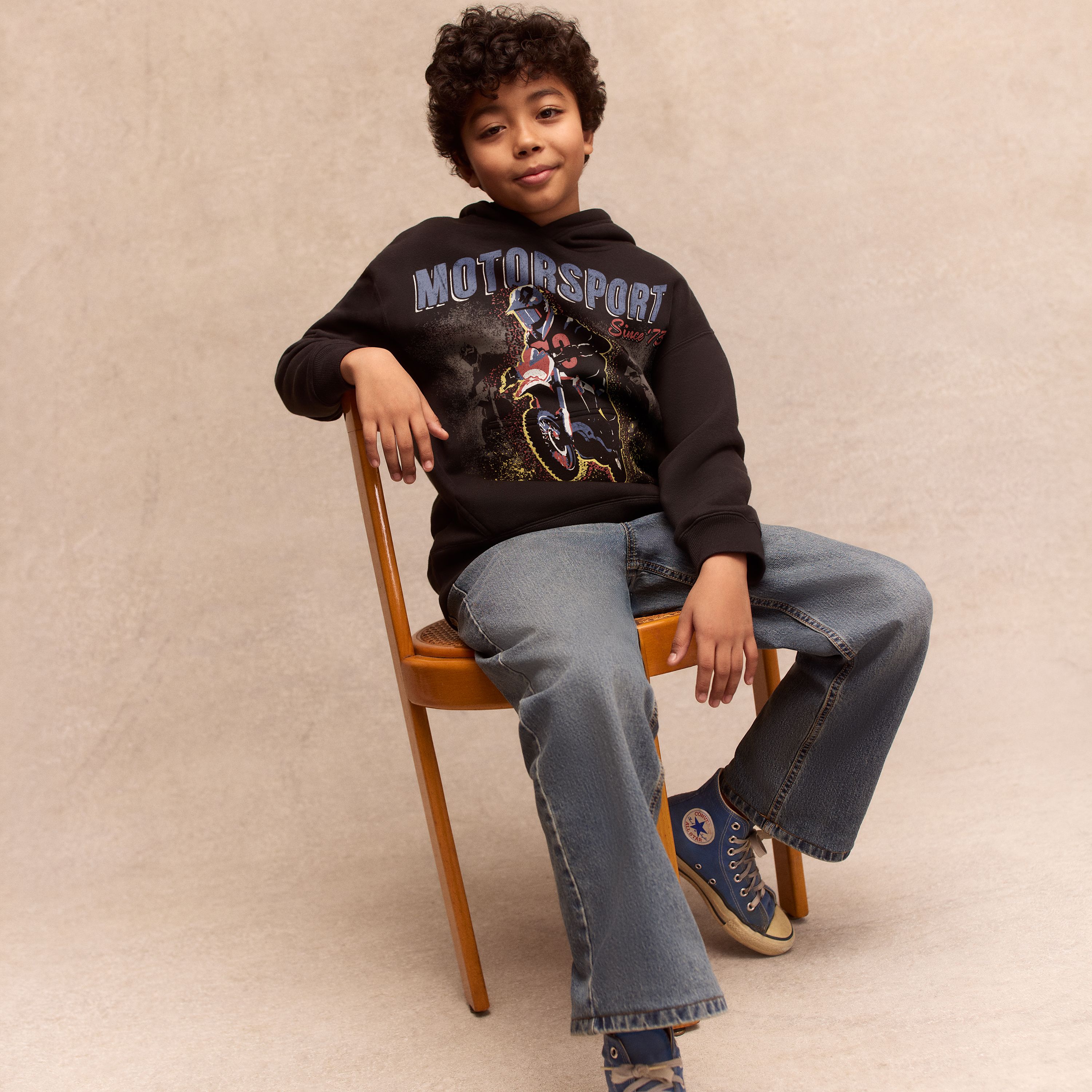 Big boy model wearing shorts and a tee.