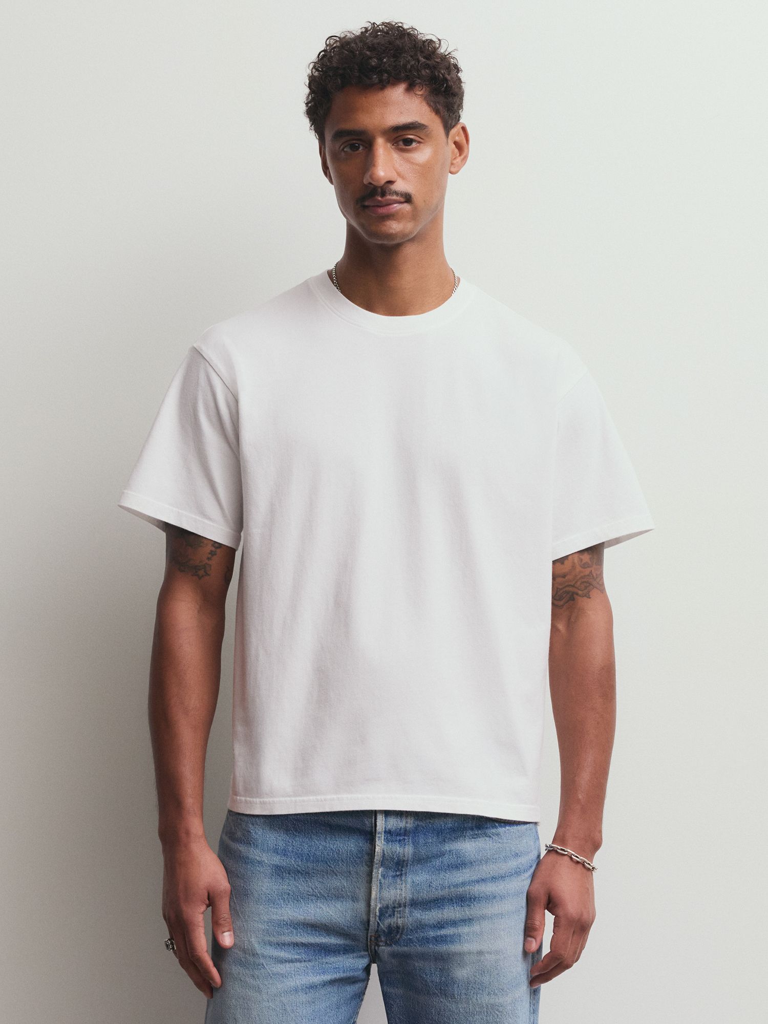 Man wearing white tee