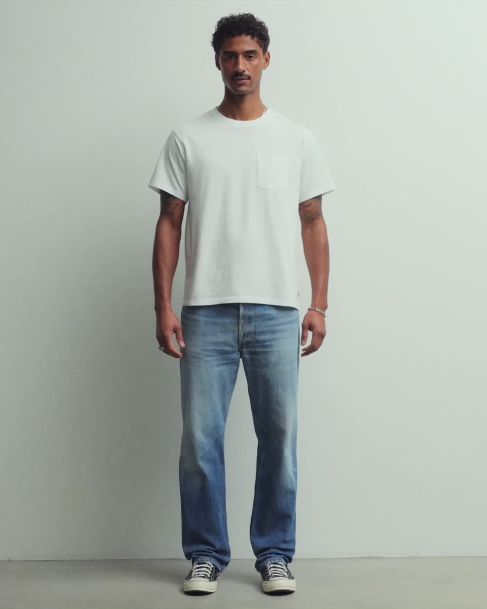 Man wearing white tee