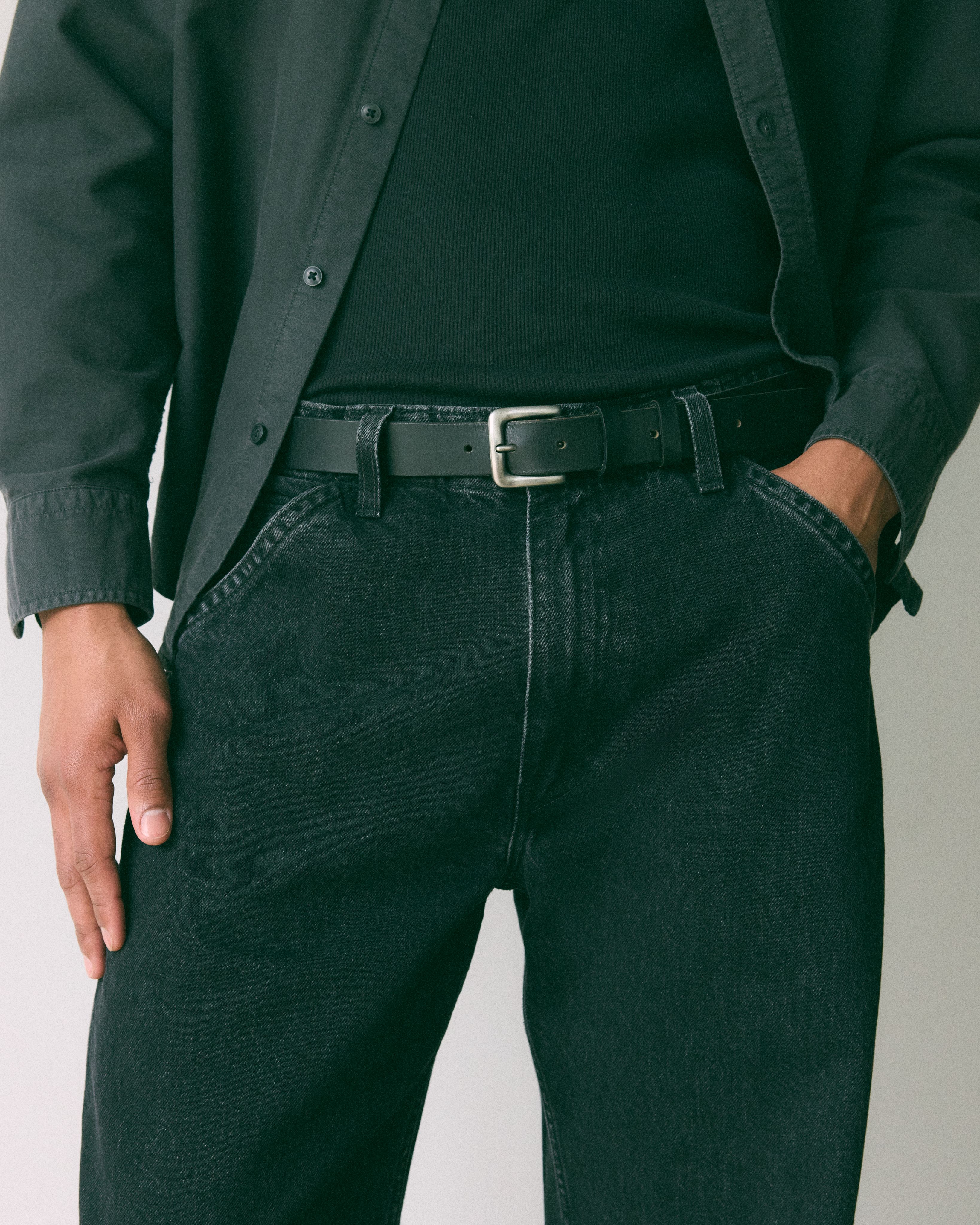 Brown belt rolled up with silver buckle.