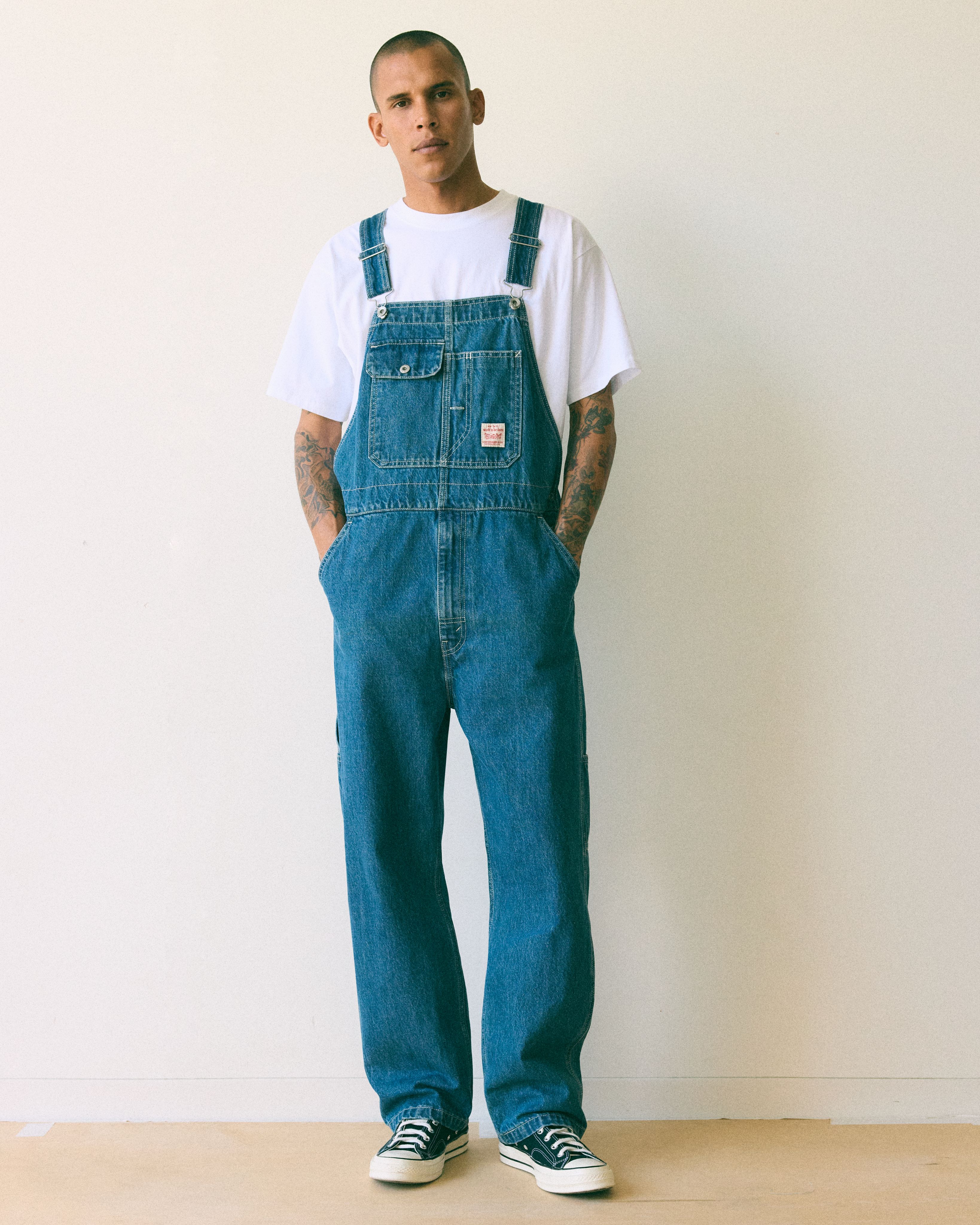 Male model wearing overalls.