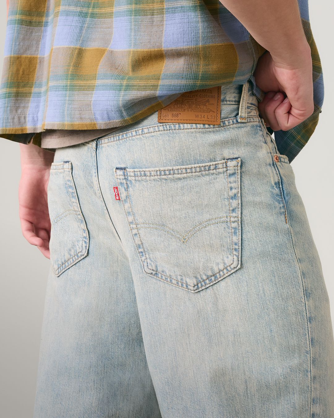Closeup buttshot of model in lightweight jeans