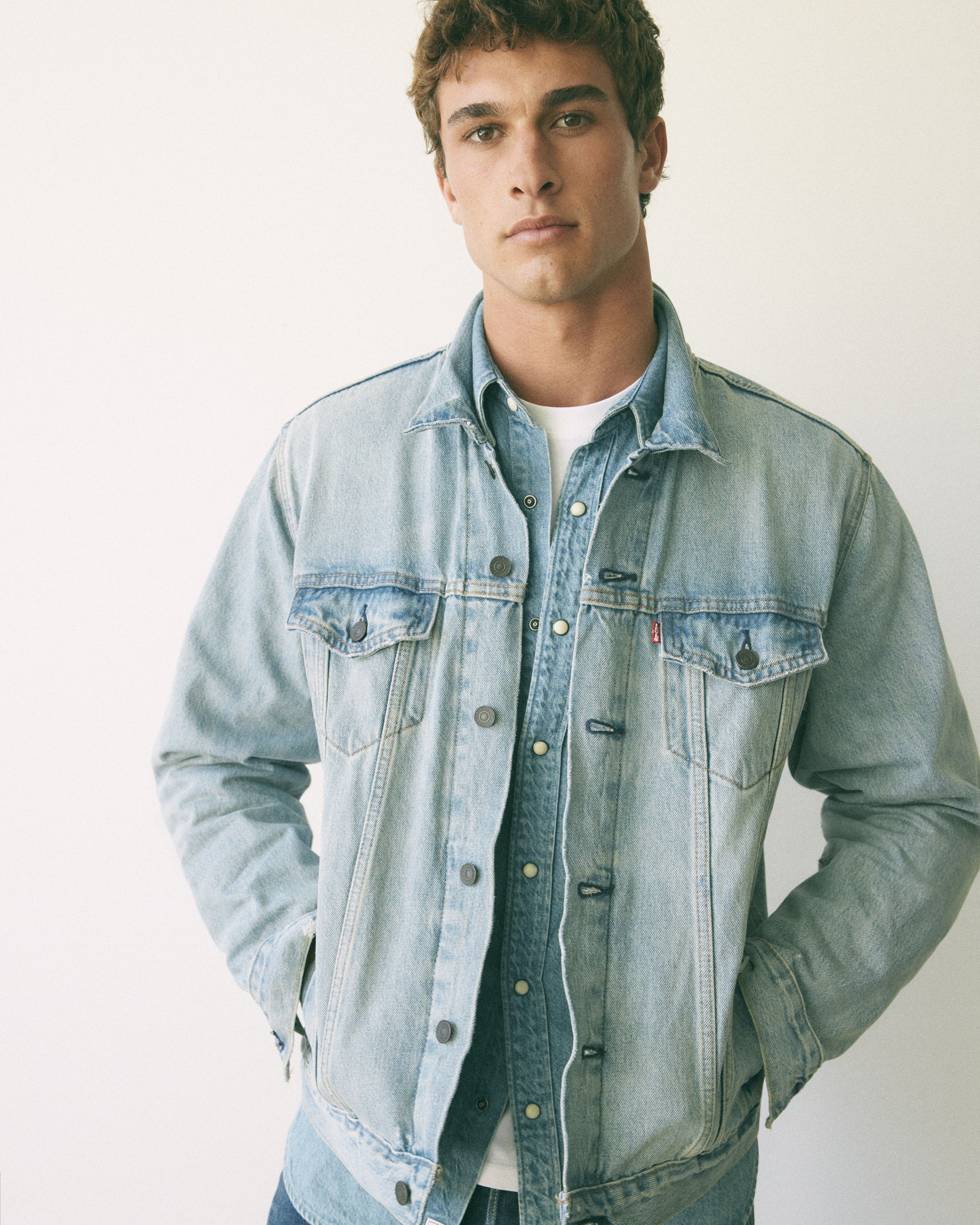 Male model wearing a jean jacket.