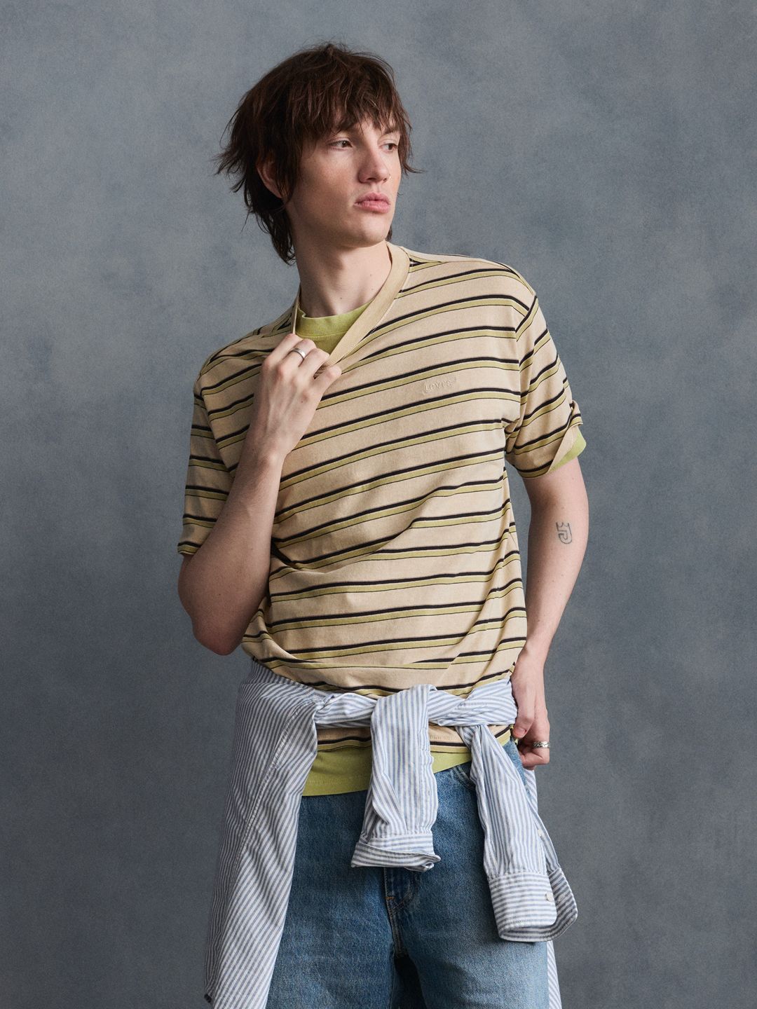 Model wearing blue shirt shirt.