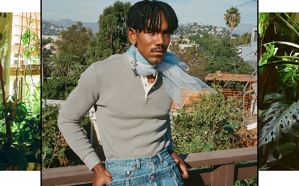 Portrait of Jerrod La Rue surrounded by plants.