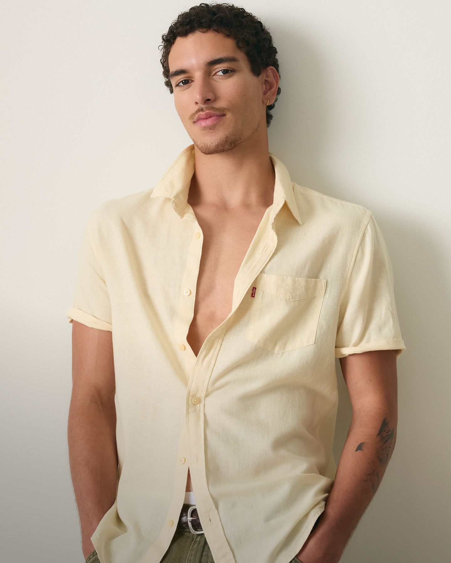 model wearing button up shirt