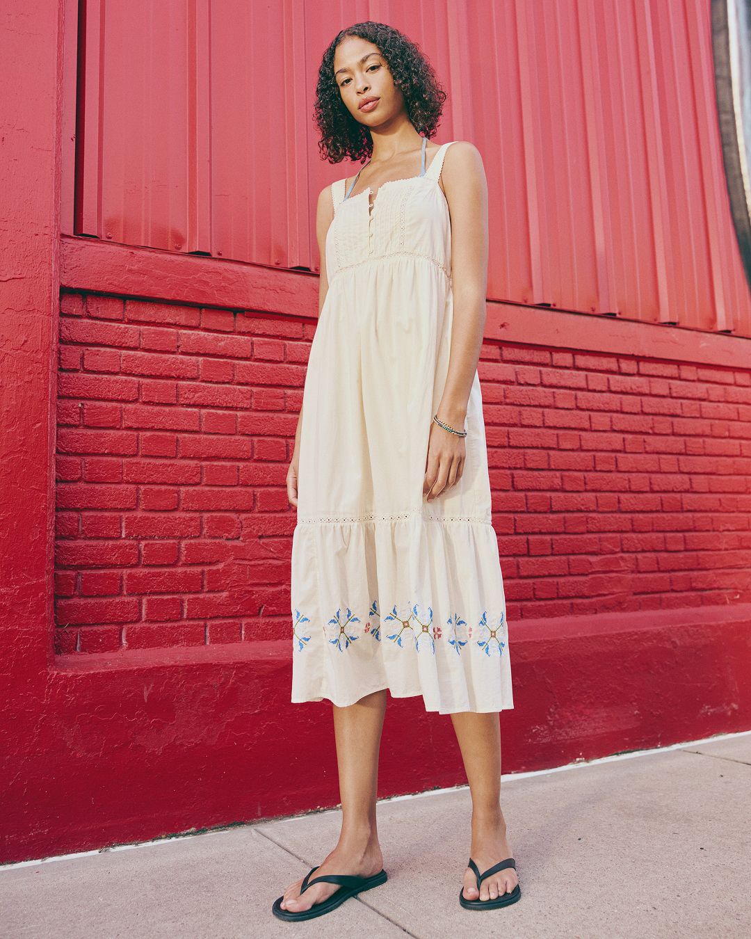 model in white midi dress