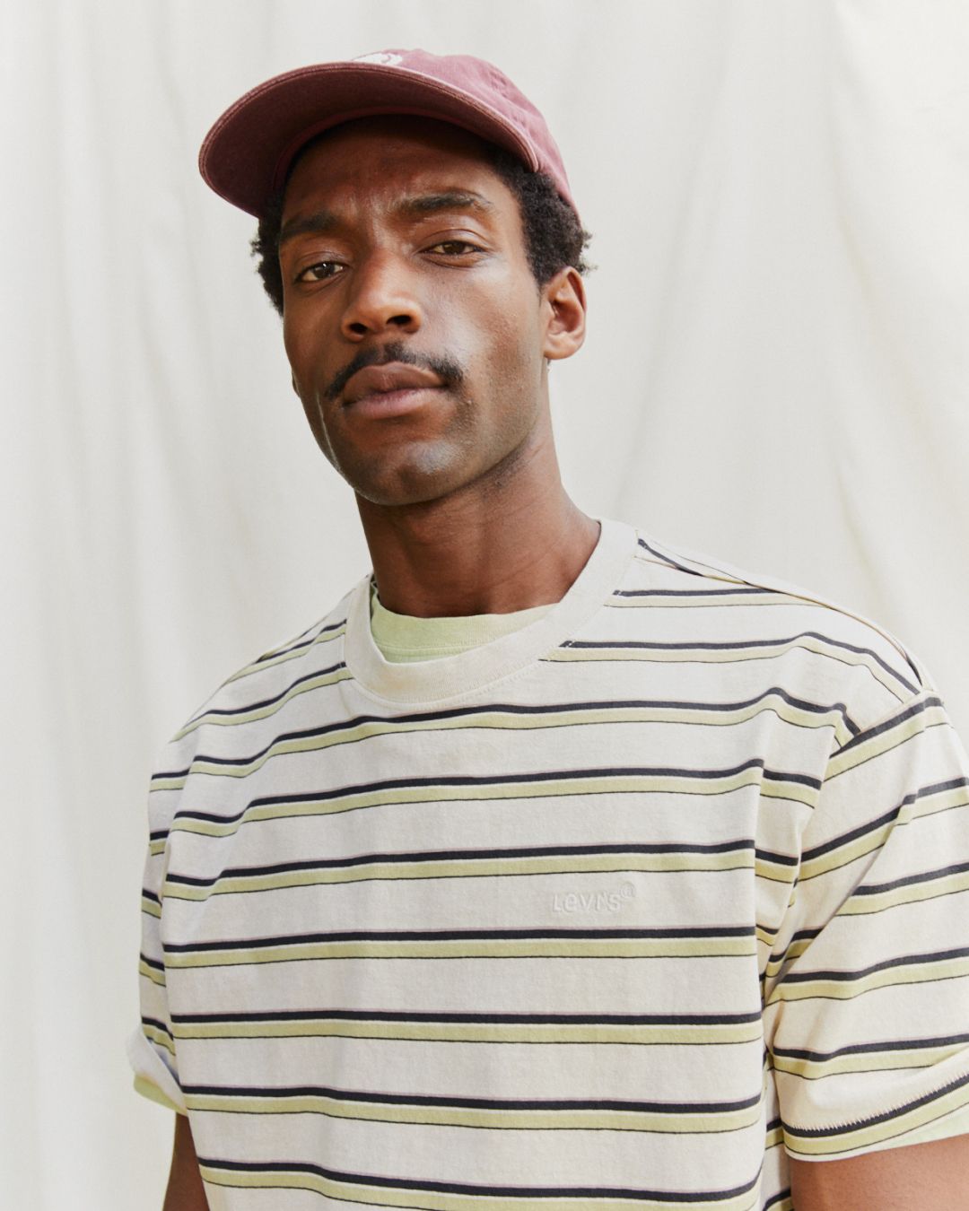 Model in men's striped tee