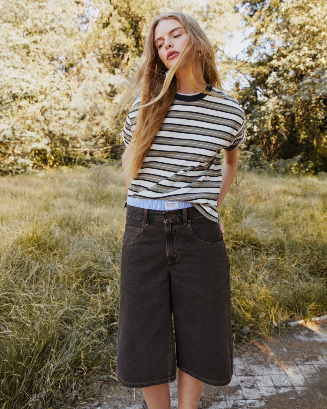 Model in women's striped tee