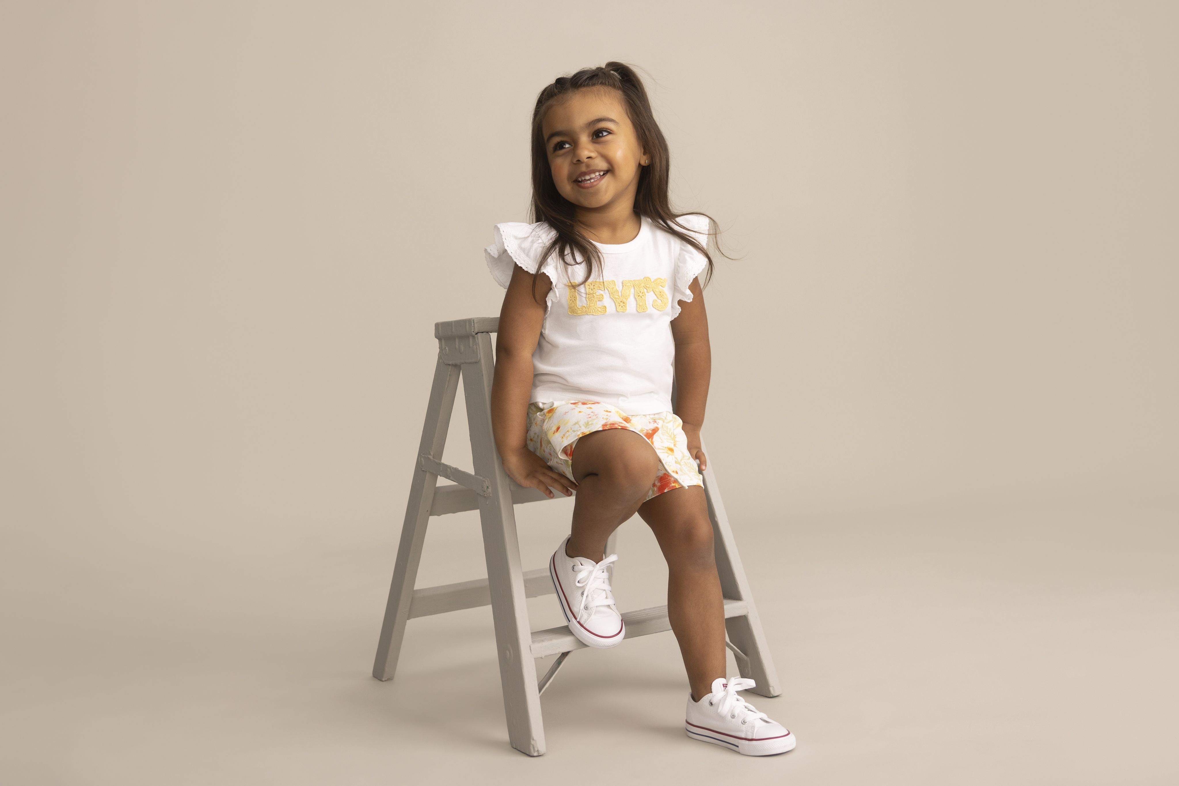 Toddler model wearing shorts and a tee.