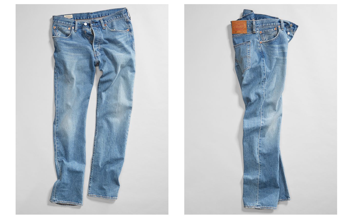 A pair of jeans spread out on the ground, two different angles of the jeans are shown.