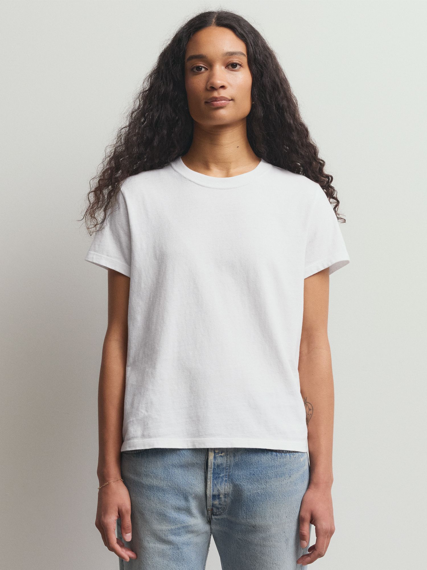 Model wearing white tee 