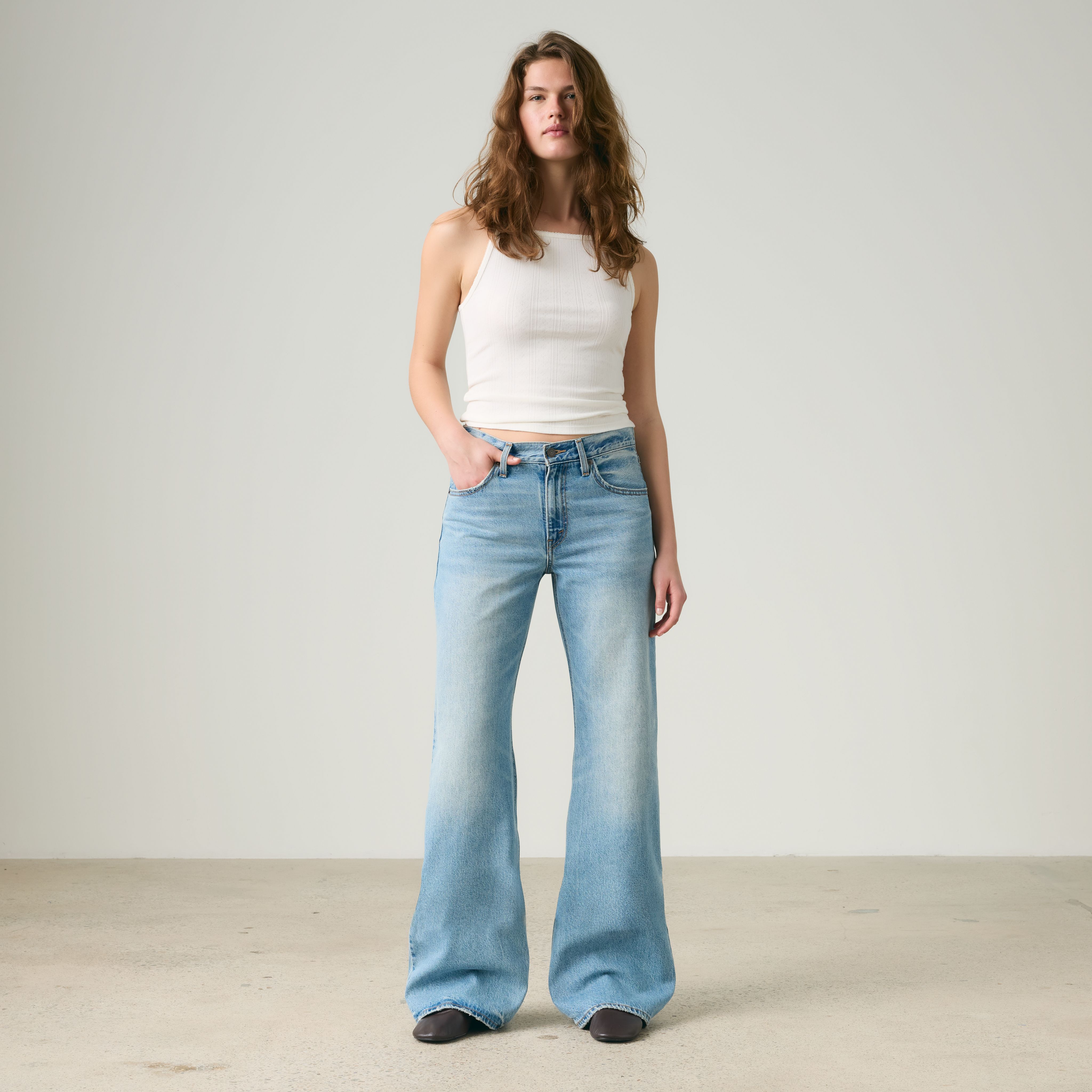 Female model wearing jeans.
