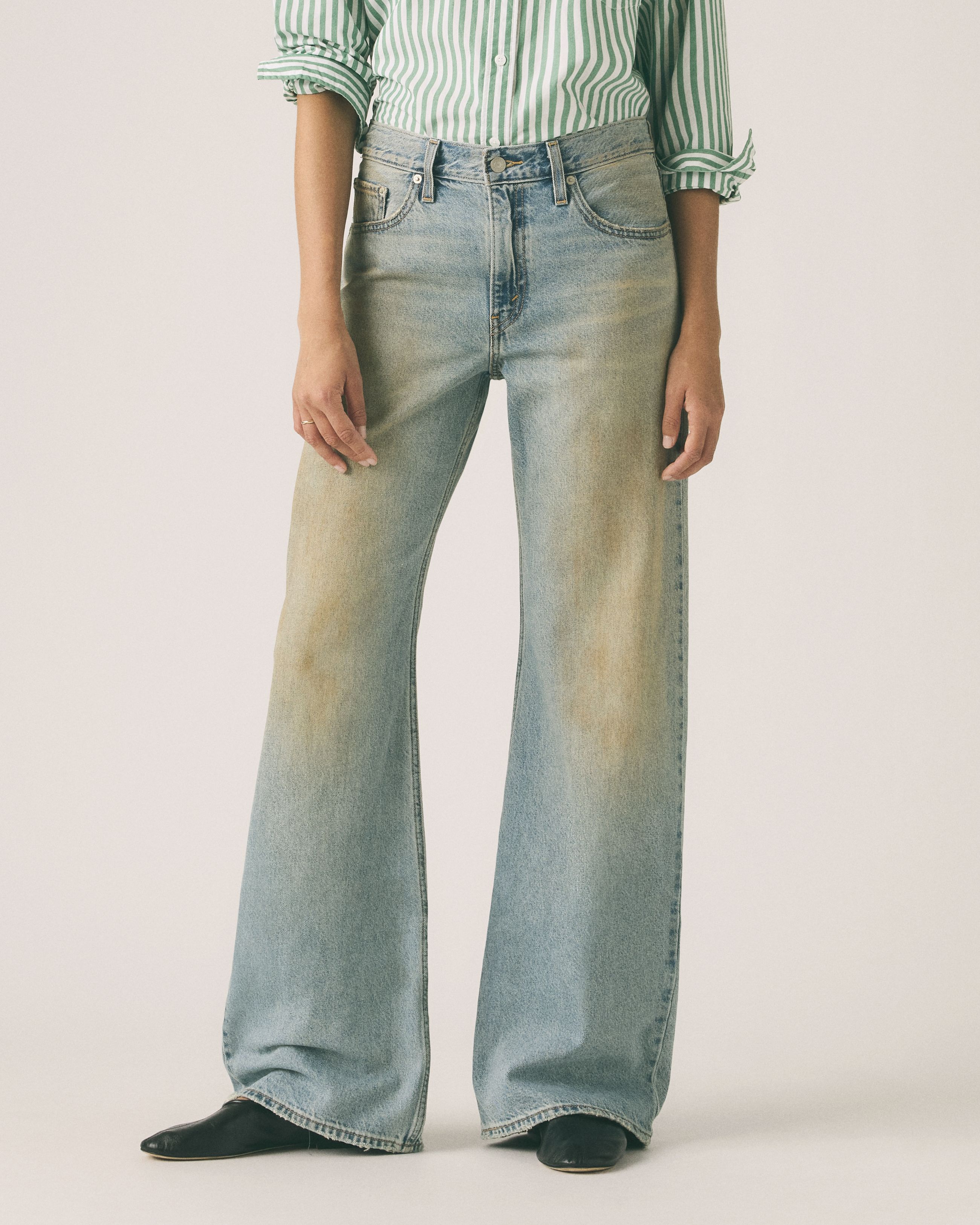 Female model wearing jeans.