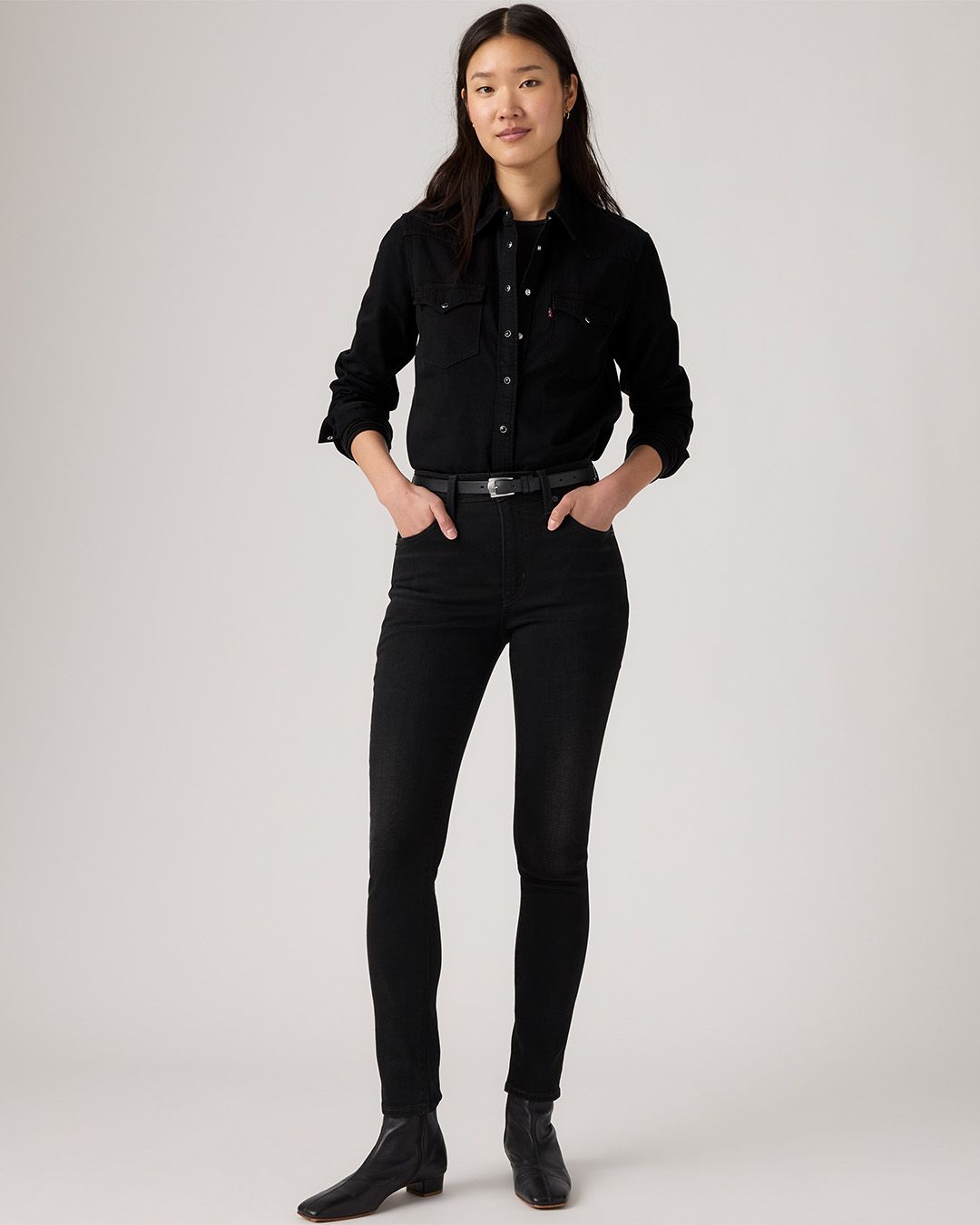 Image of model wearing slim jeans