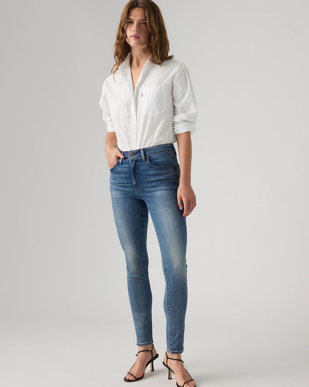 Image of model wearing slim jeans