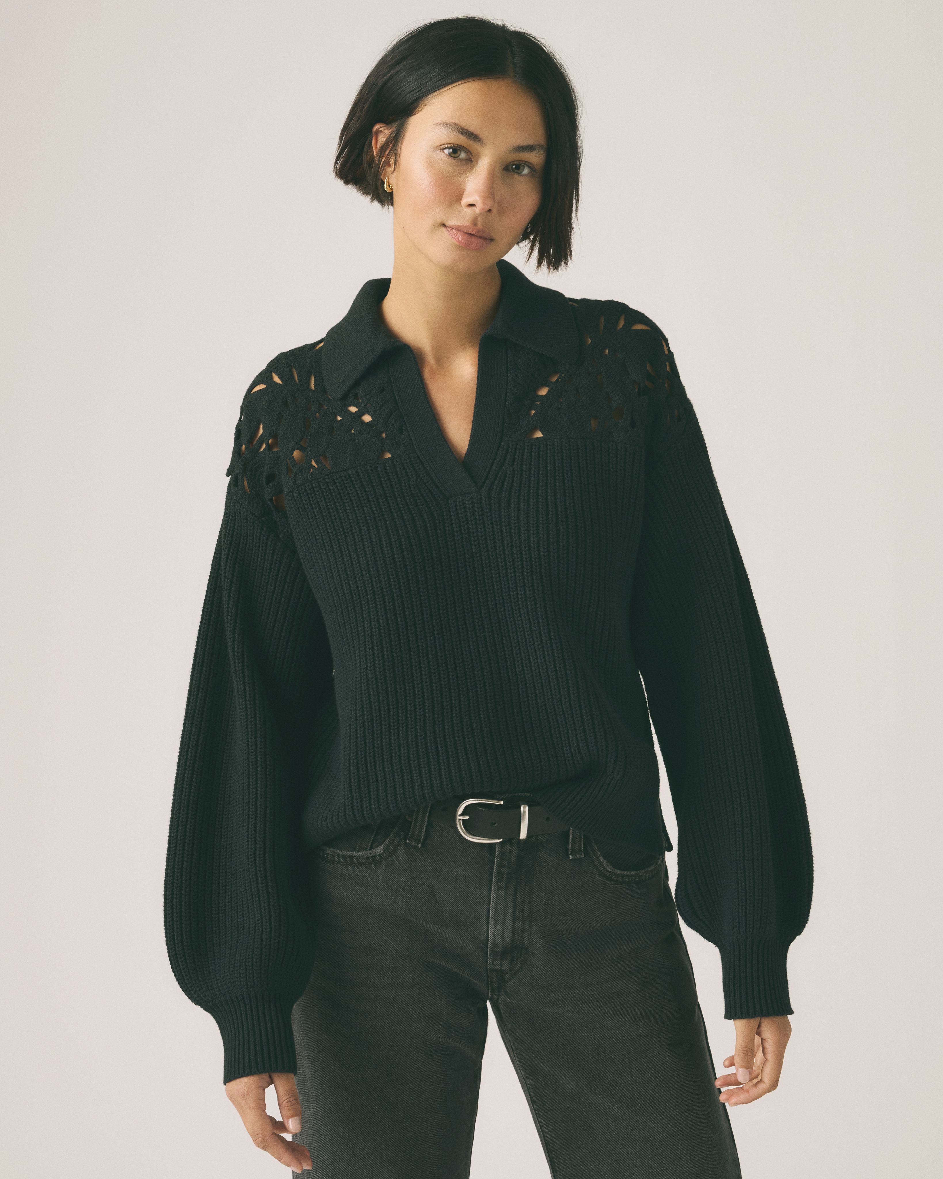 Model wearing white sweater