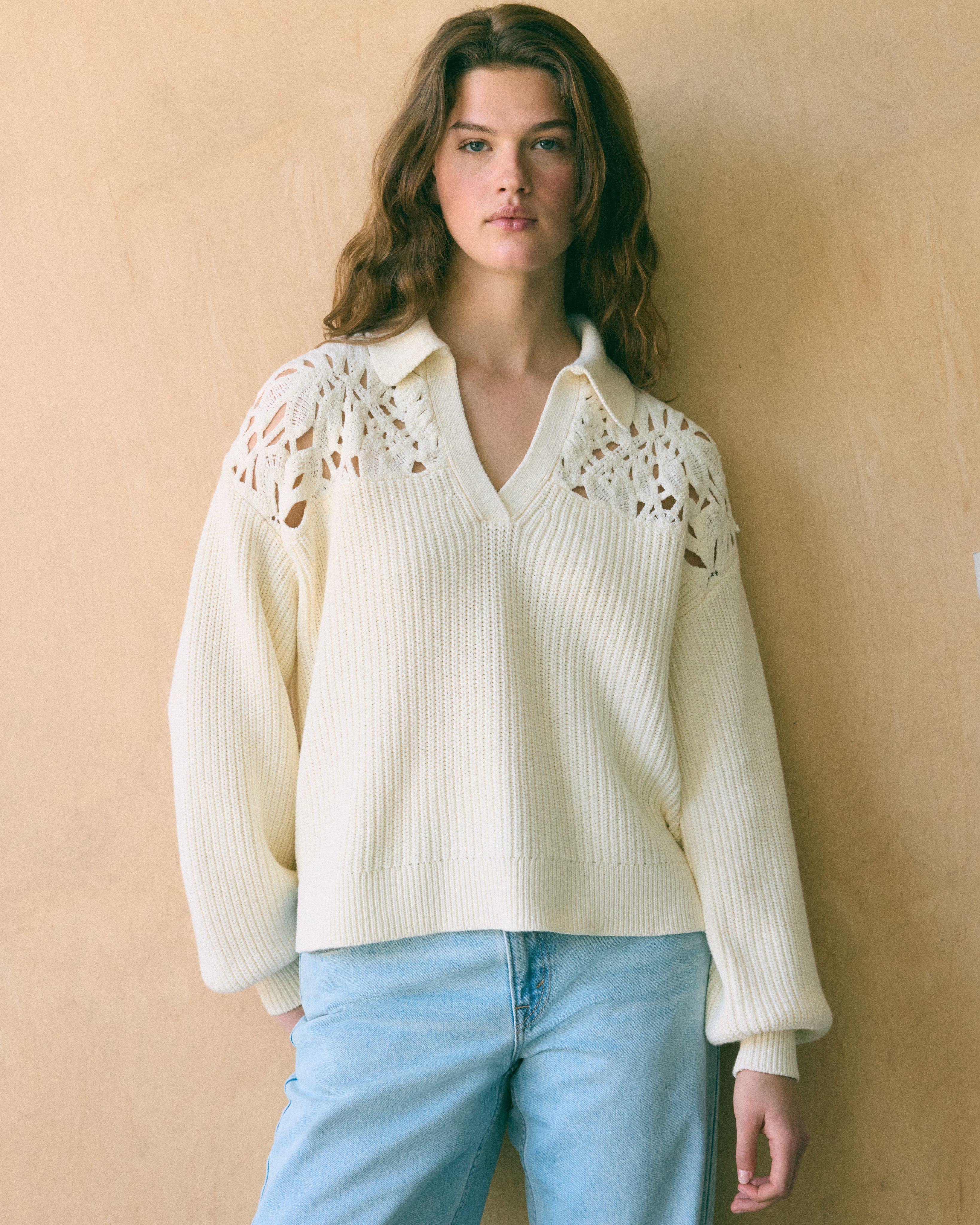 Model wearing white sweater