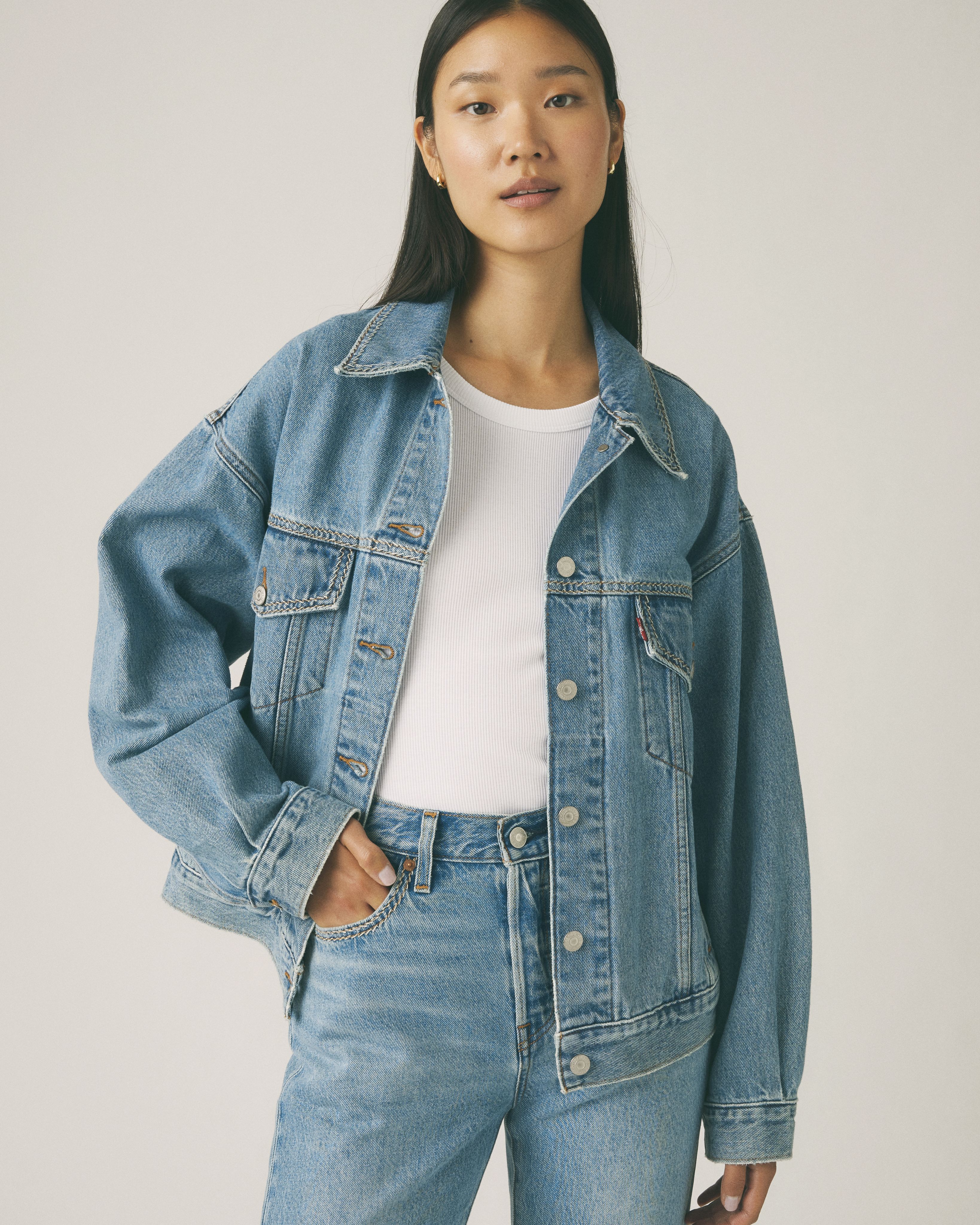 Female model wearing 90's Trucker