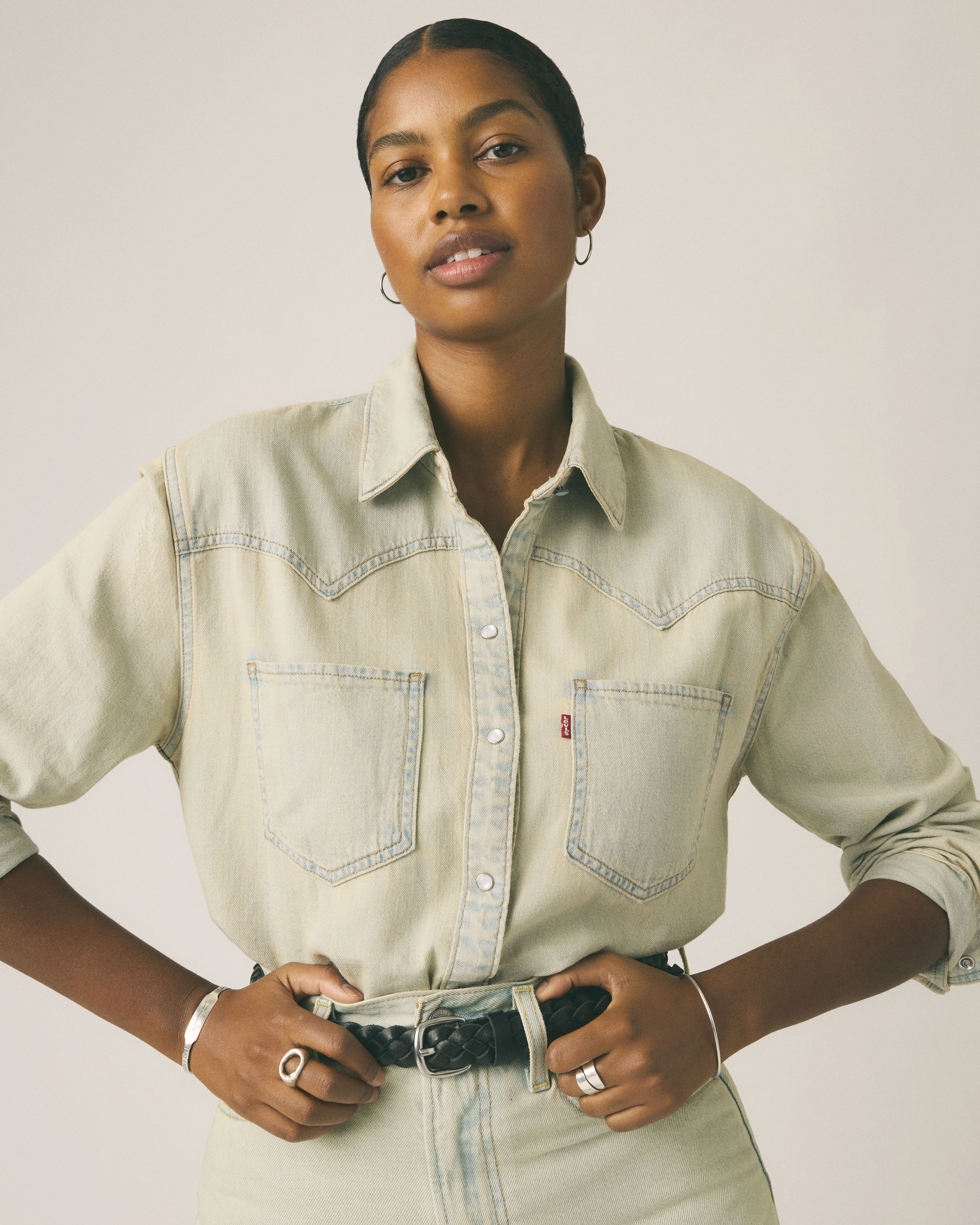 Model wearing western button-up top.