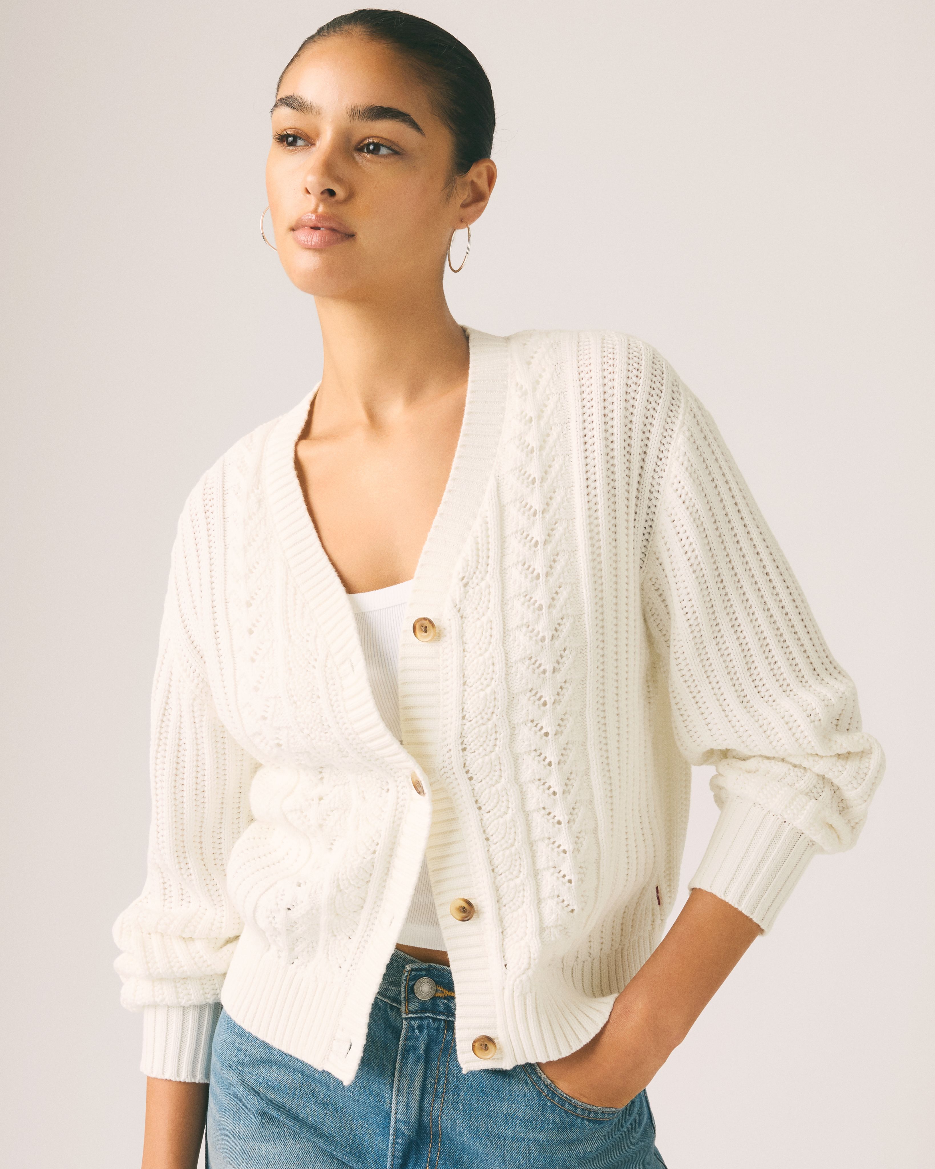 Female model wearing snowflake cardigan