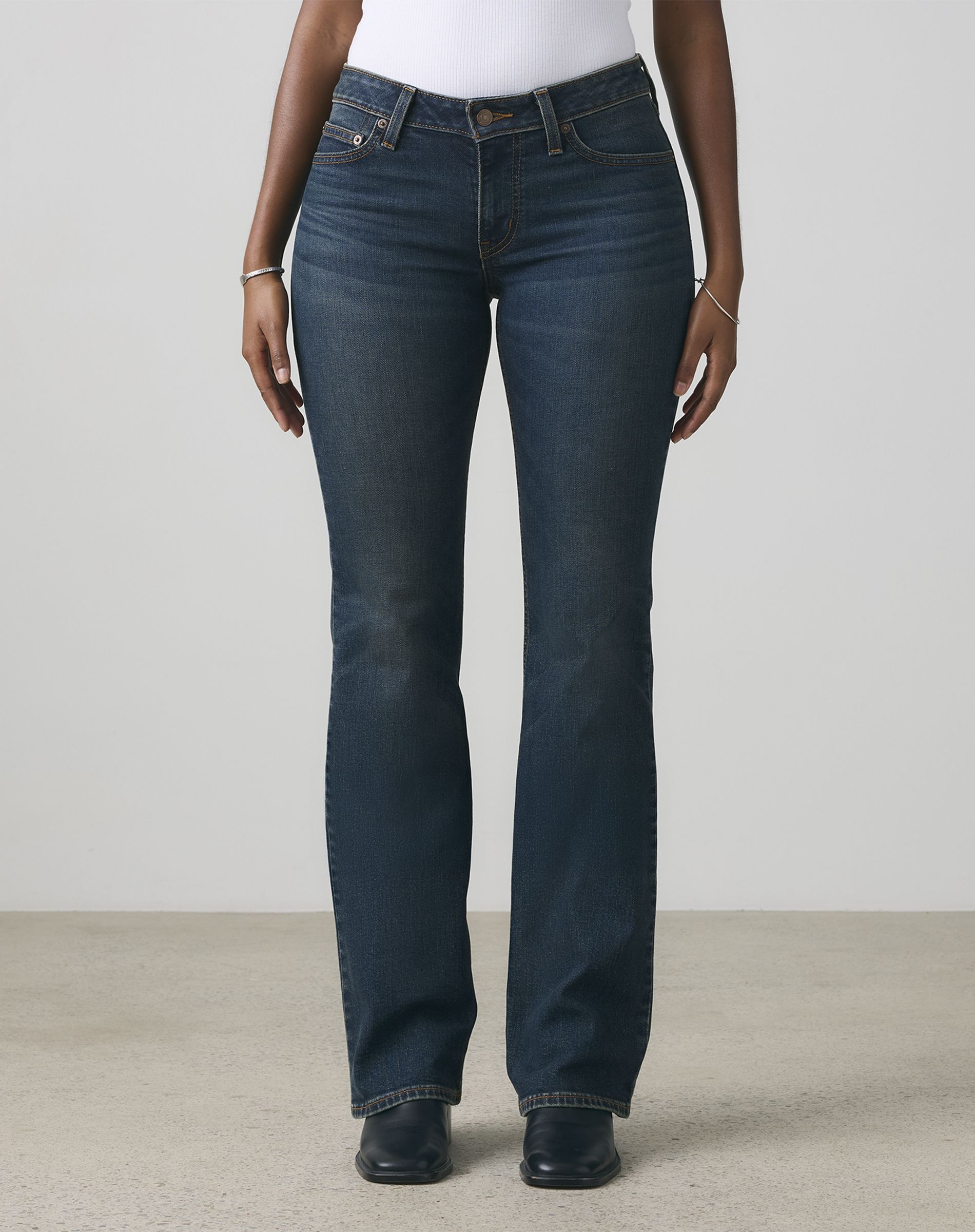 Female model wearing Bootcut & Flare jeans.