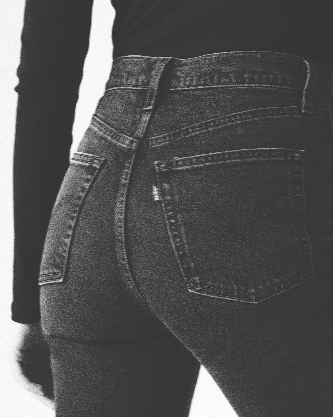 photo of a woman wearing black denim