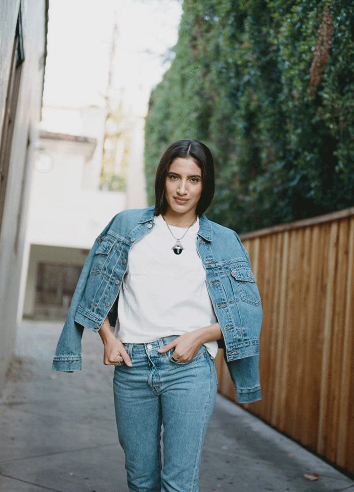 GIFs of ABIR wearing a Levi's Trucker Jacket and jeans outside in LA.