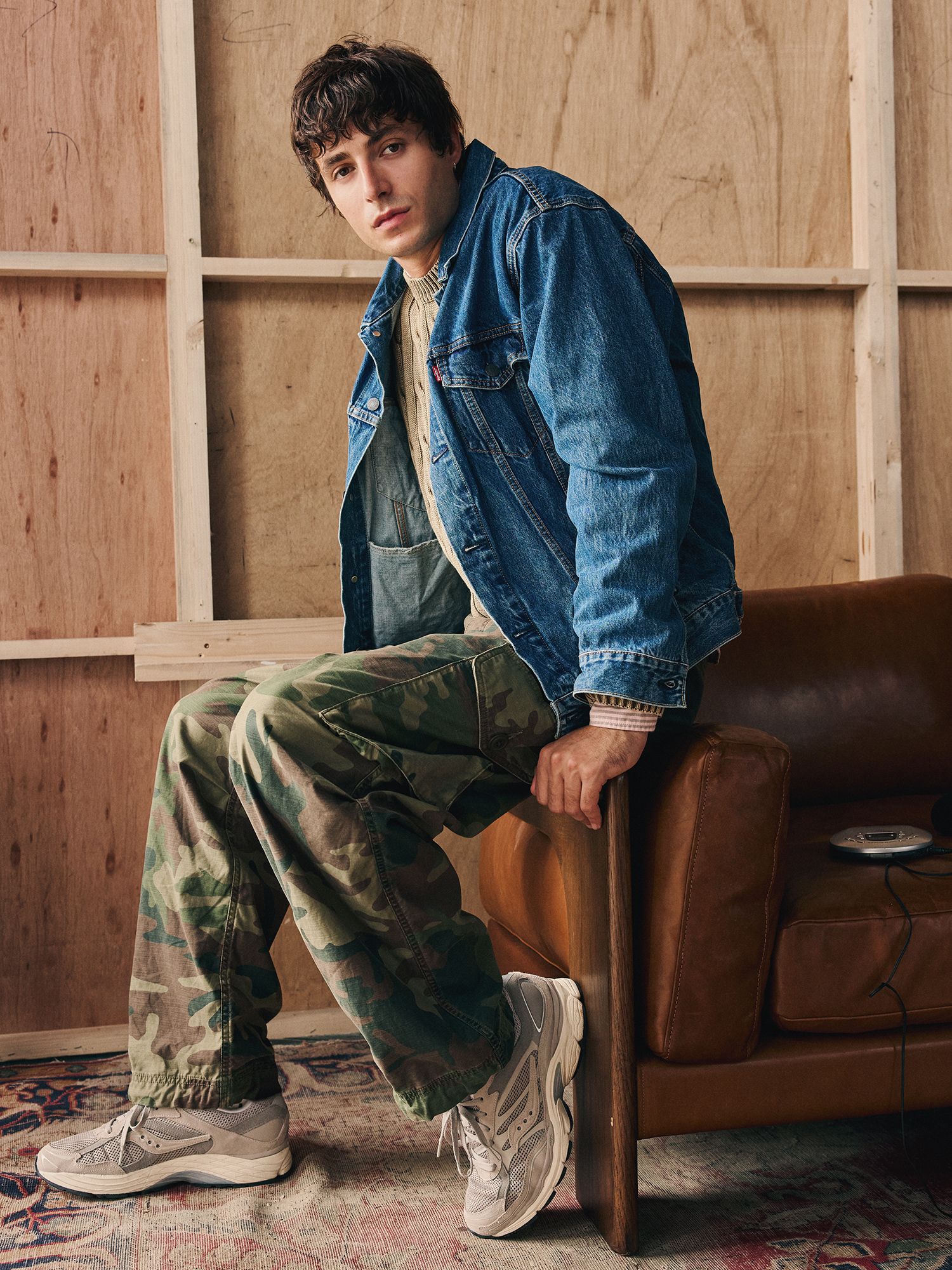 model in denim jacket and cargos