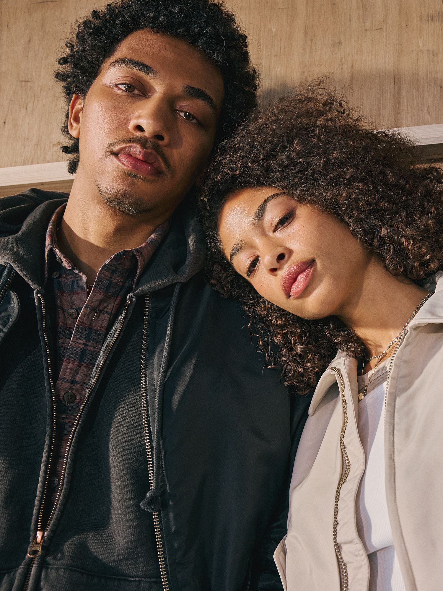 male and female model in outerwear